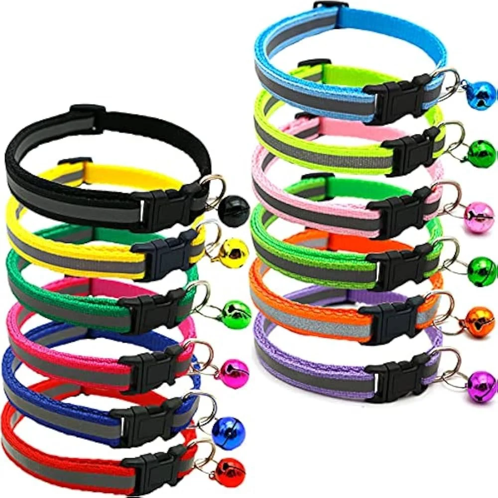 Multiple colorful LED pet collars stacked together, featuring different neon colors including blue, green, pink, orange, purple, red, and black, with bell attachments.