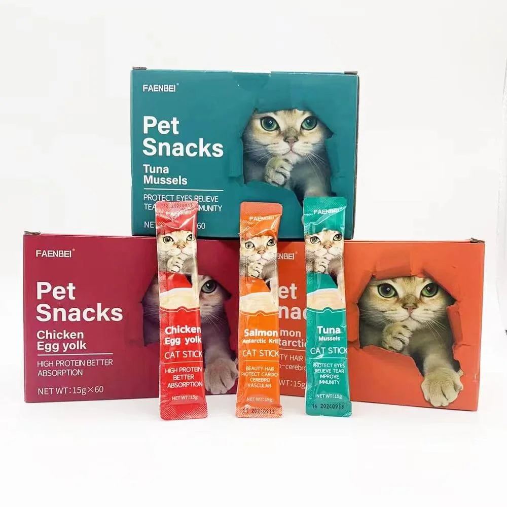 Boxes of pet snacks with cat images and flavor labels such as tuna, chicken, and salmon, arranged with individual treat sticks in front.