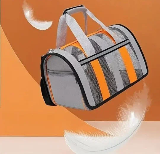 A gray and orange sports duffel bag with mesh side panels, set against an abstract orange background with floating white feathers and a moon.