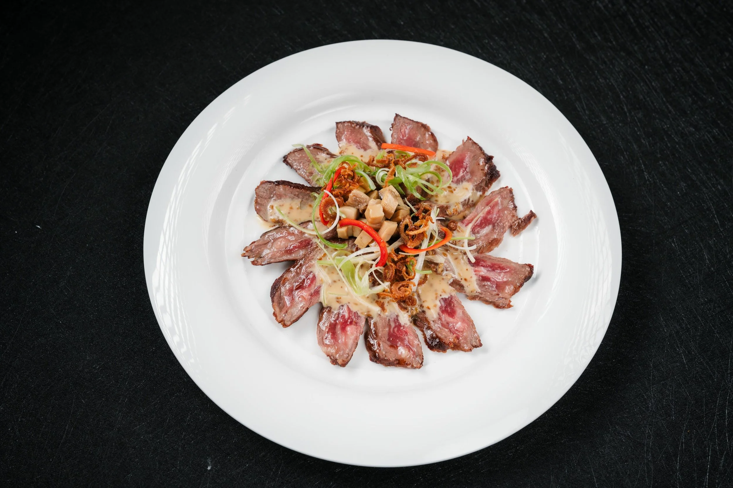 Sliced Wagyu With Mushrooms and Sesame Sauce $55