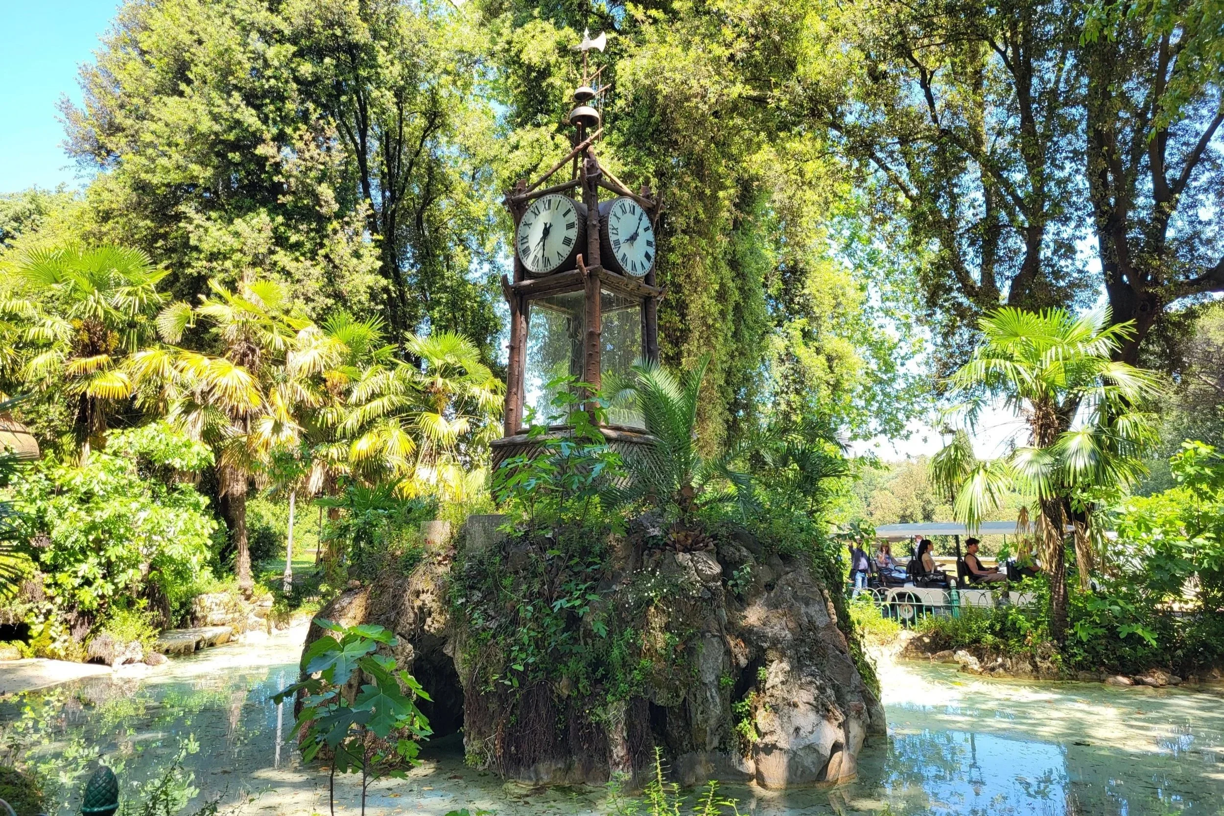The Pincio Water Clock surrounded by trees in Villa Borghese