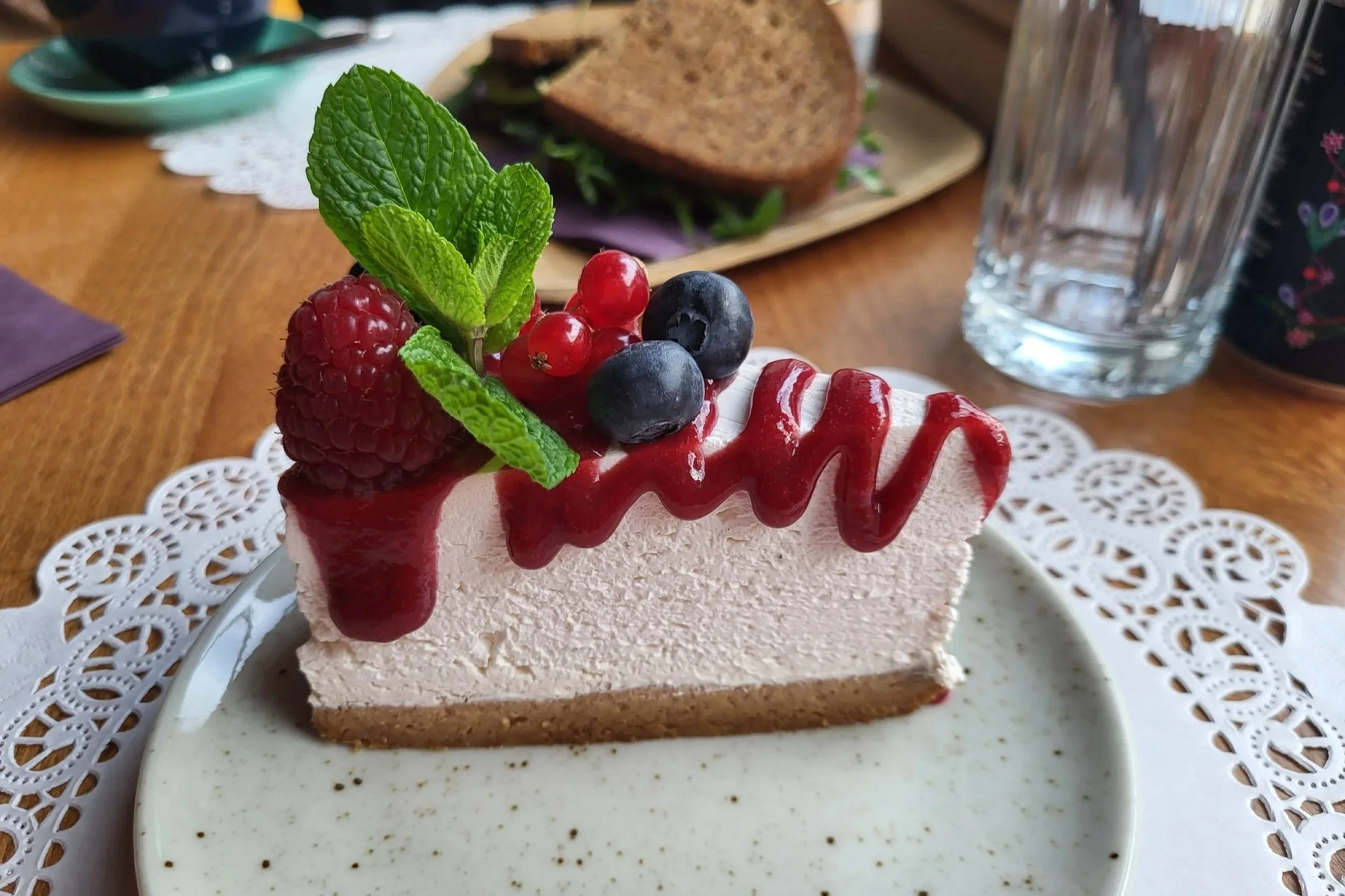 Vegan cheesecake with fruits at Romeow Cat Bistrot