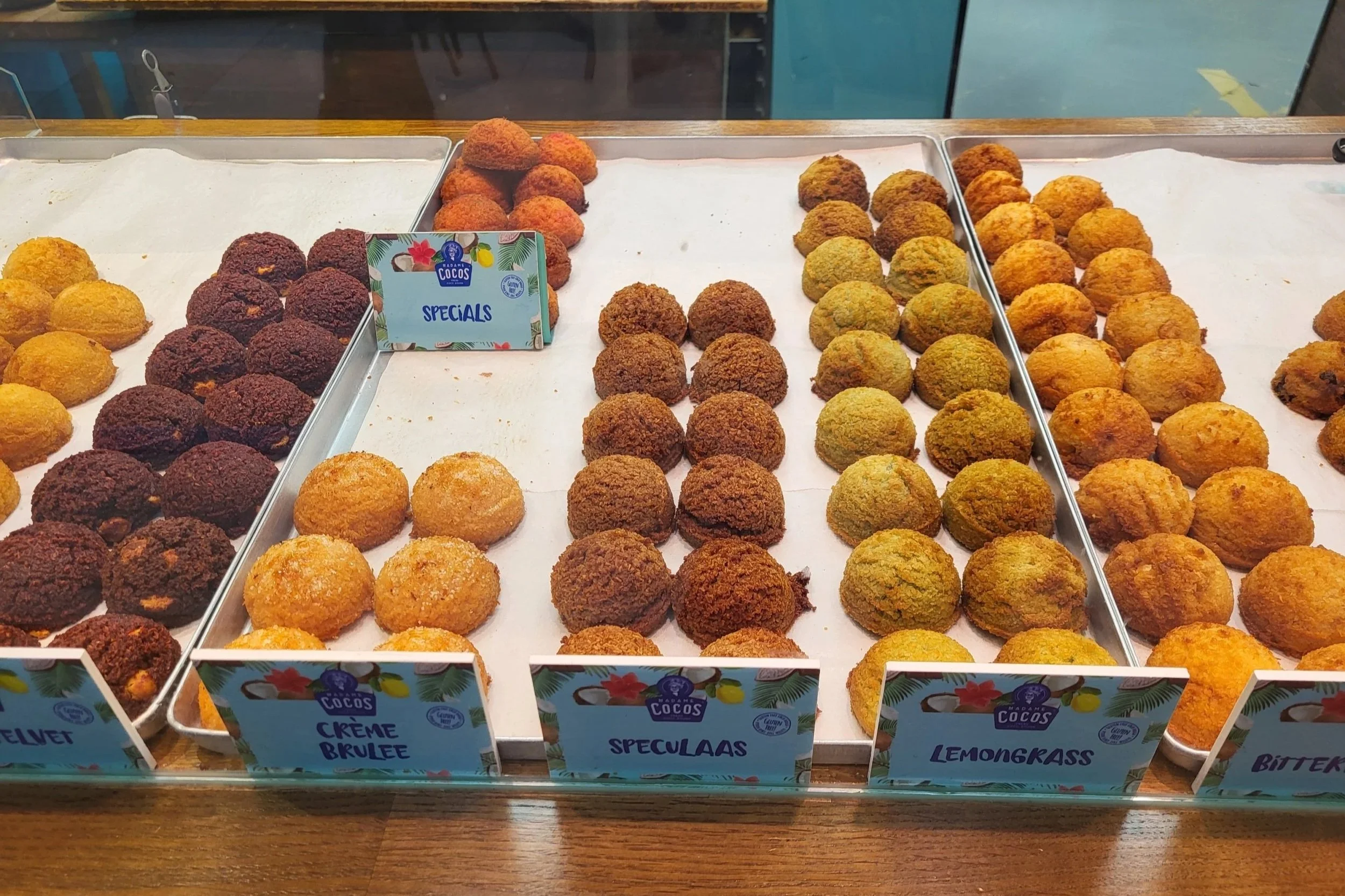 Madame Cocos display full of gluten free coconut balls in different flavours