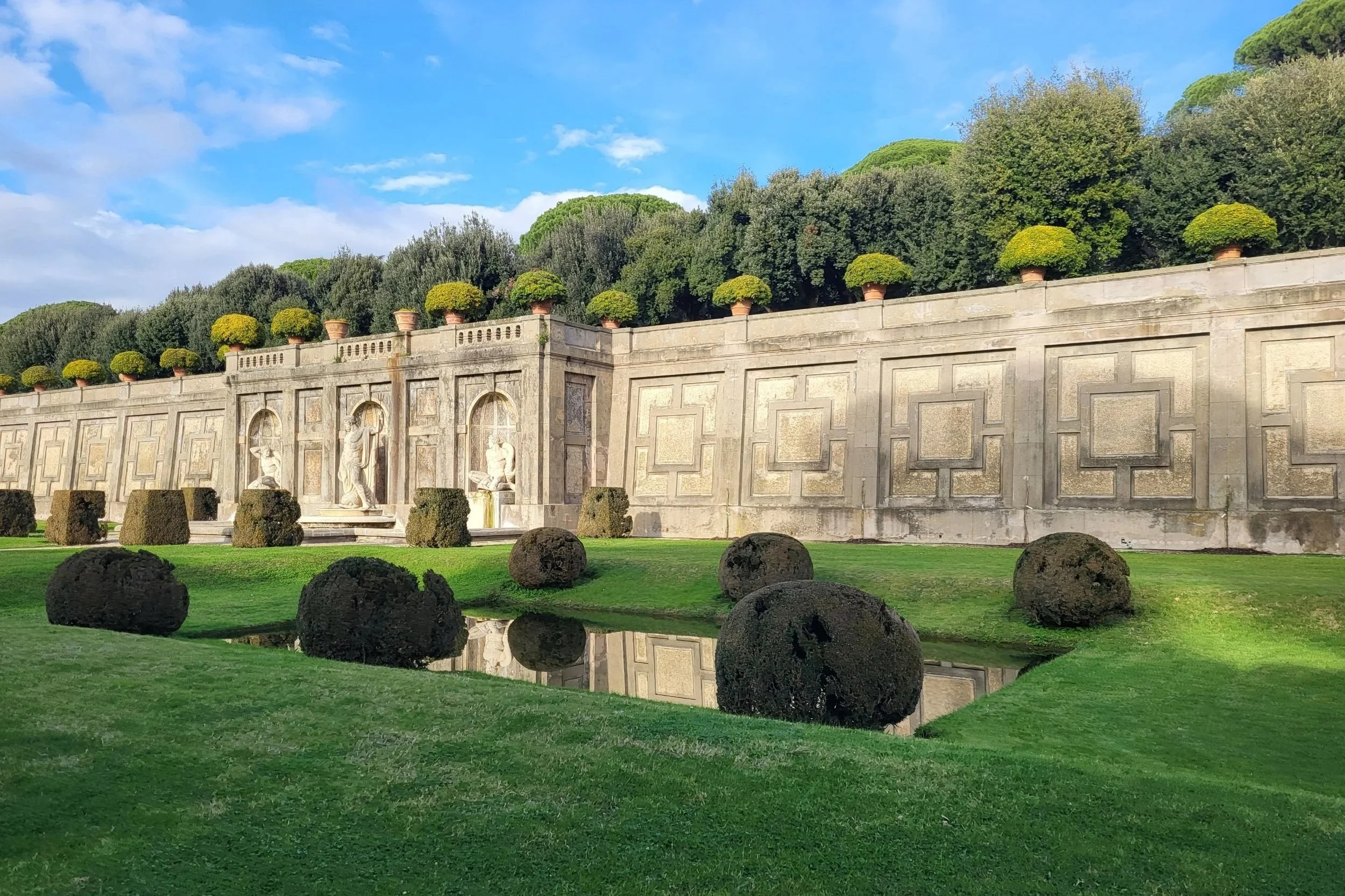 Wall and beautifully kept gardens at Borgo Laudato Si’