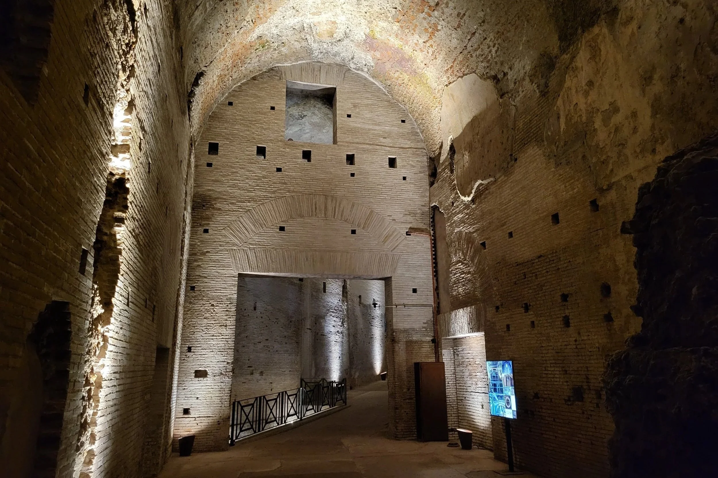 Dimly lit underground corridors of the Domus Aurea