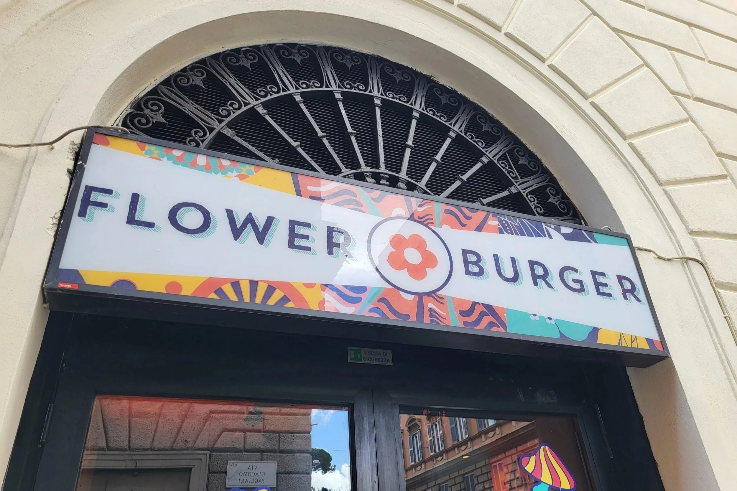 Logo of Flower Burger above the entrance