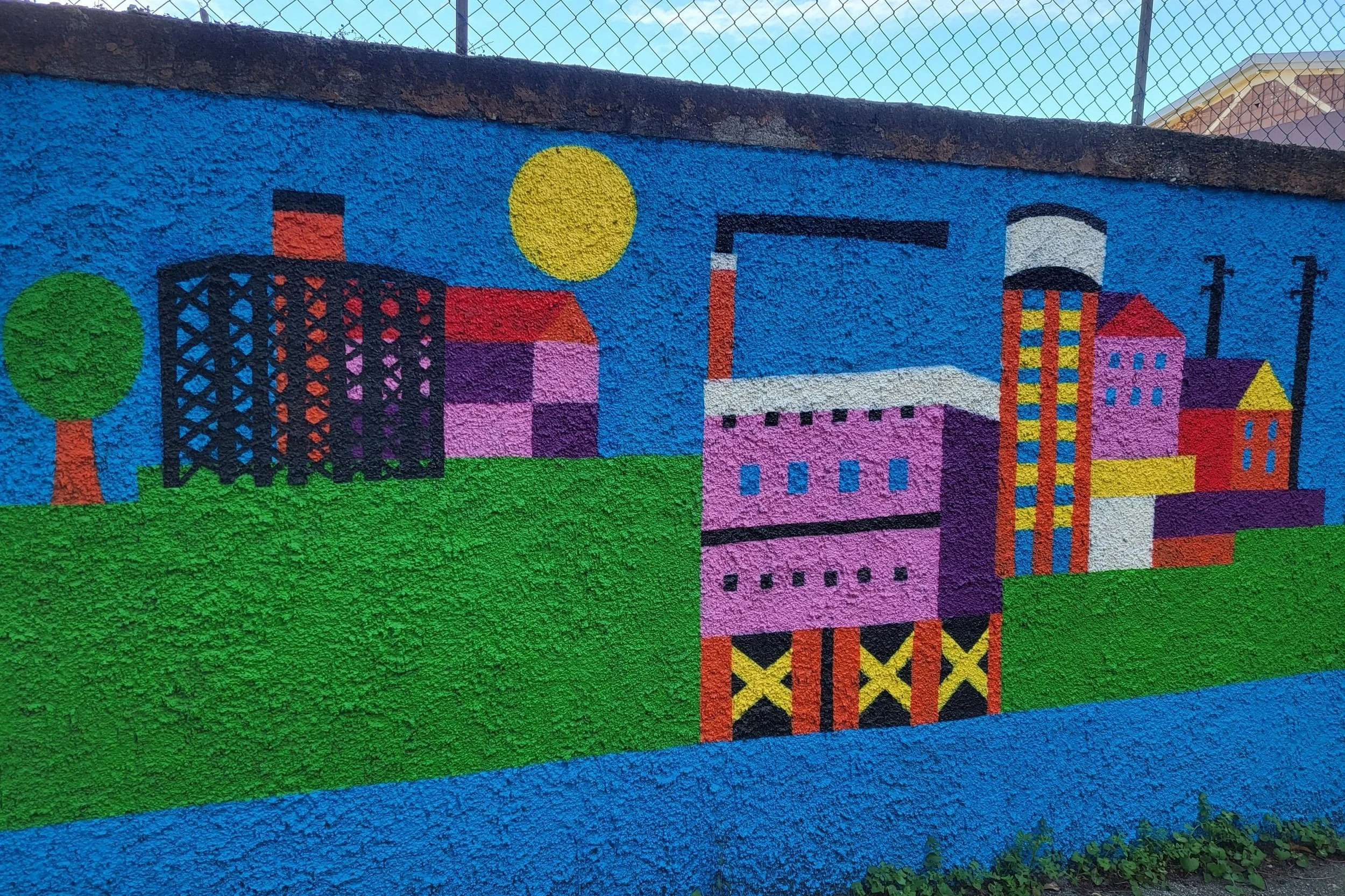 Colorful street art mural in Ostiense, showcasing the neighbourhood's creative vibe