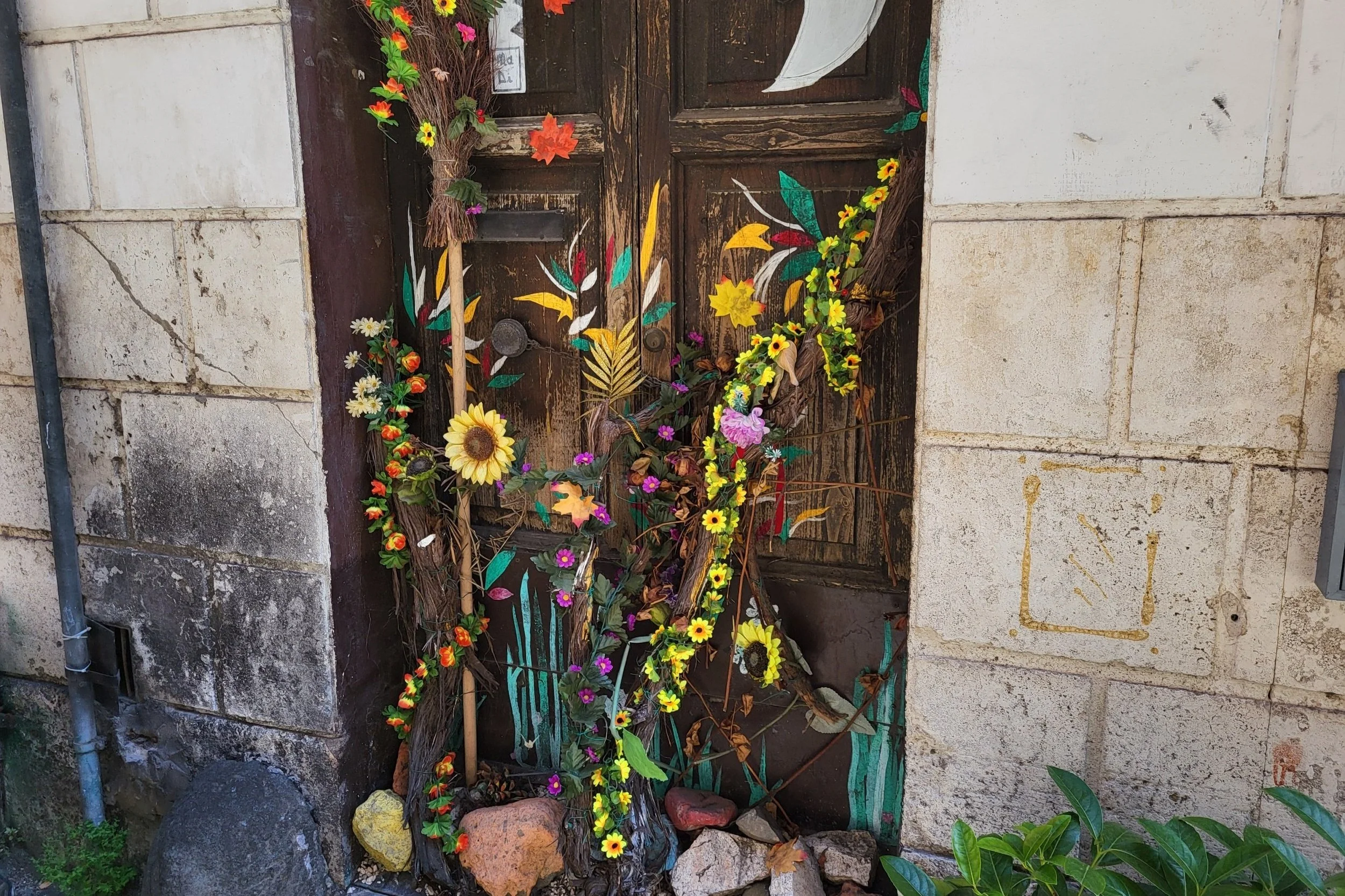 Decorated door in Monti Rome with flowers