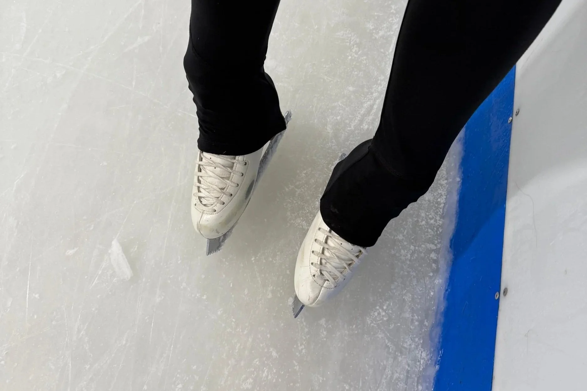 Picture of a pair of figure skates on the ice