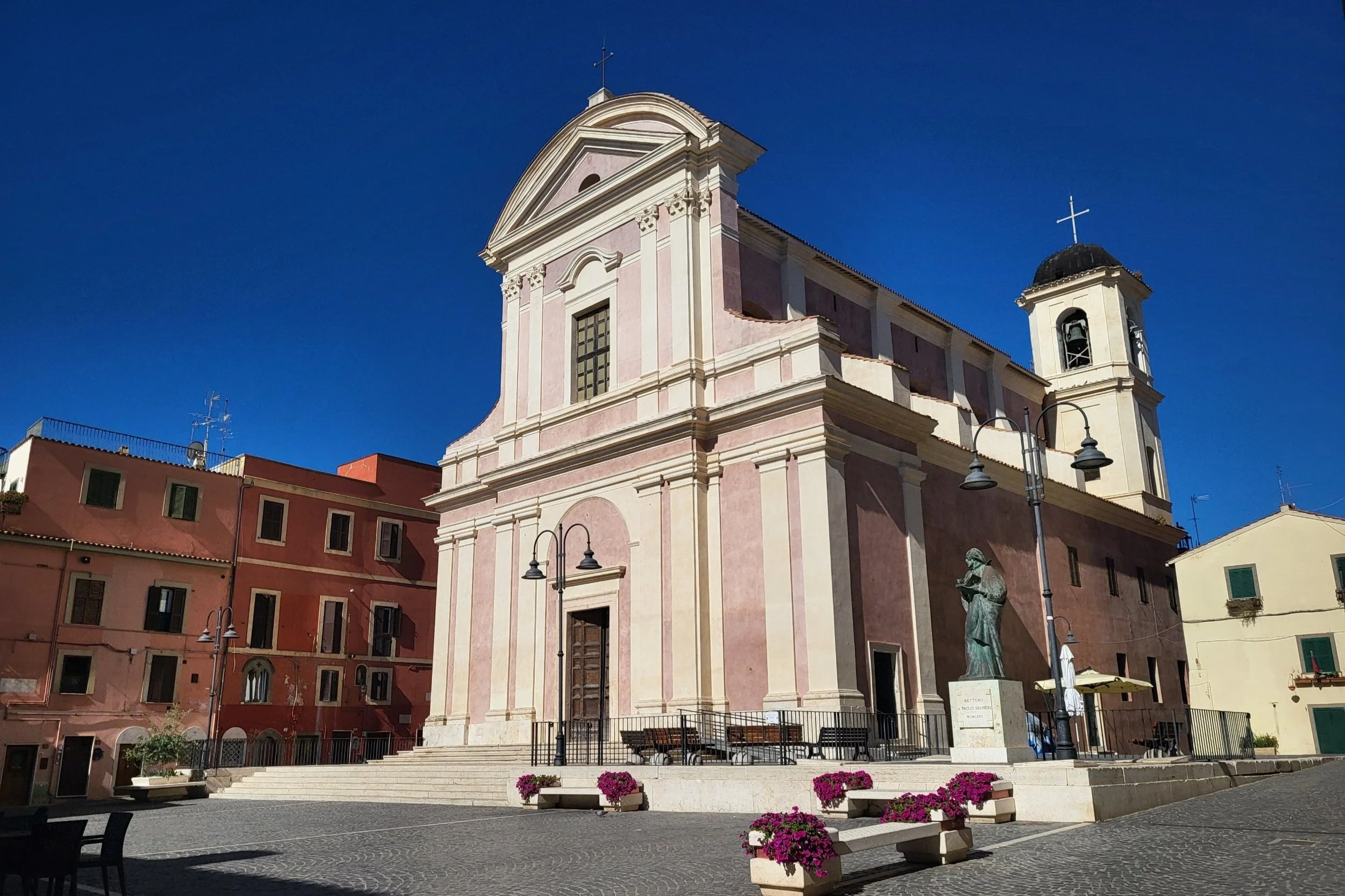 The pink facade of the Church of Saint John the Baptist in Nettuno’s medieval borgo