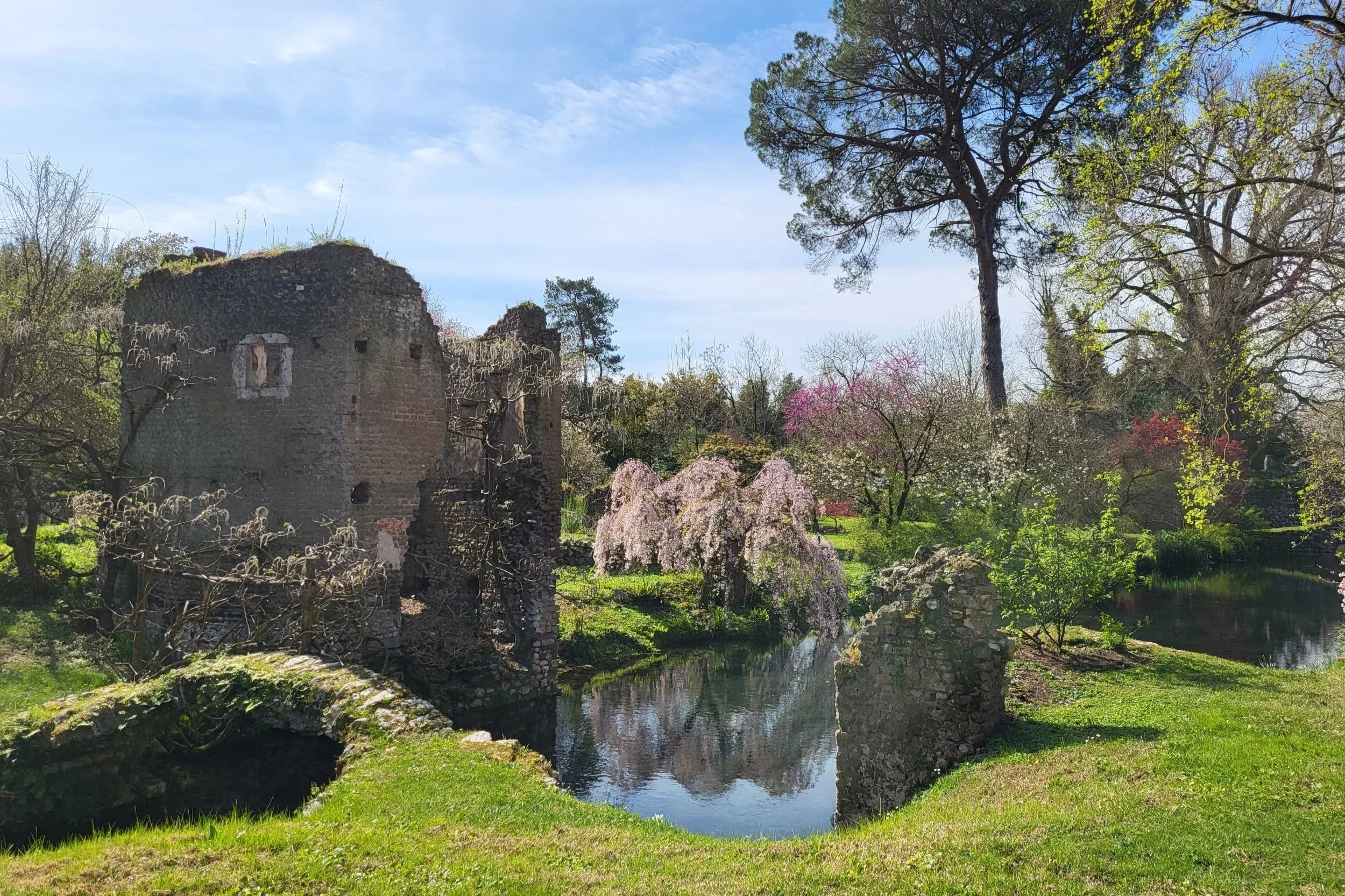 Historic ruins and river inside Giardino di Ninfa garden Lazio