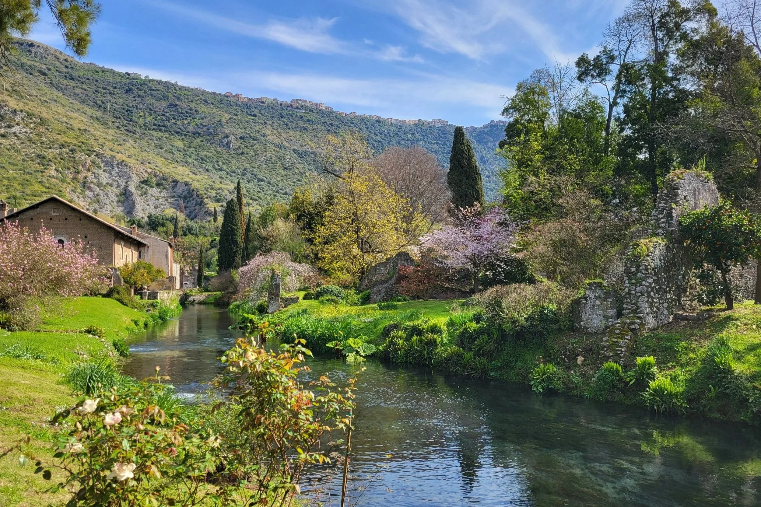 Fairytale garden scenery at Giardino di Ninfa during spring bloom