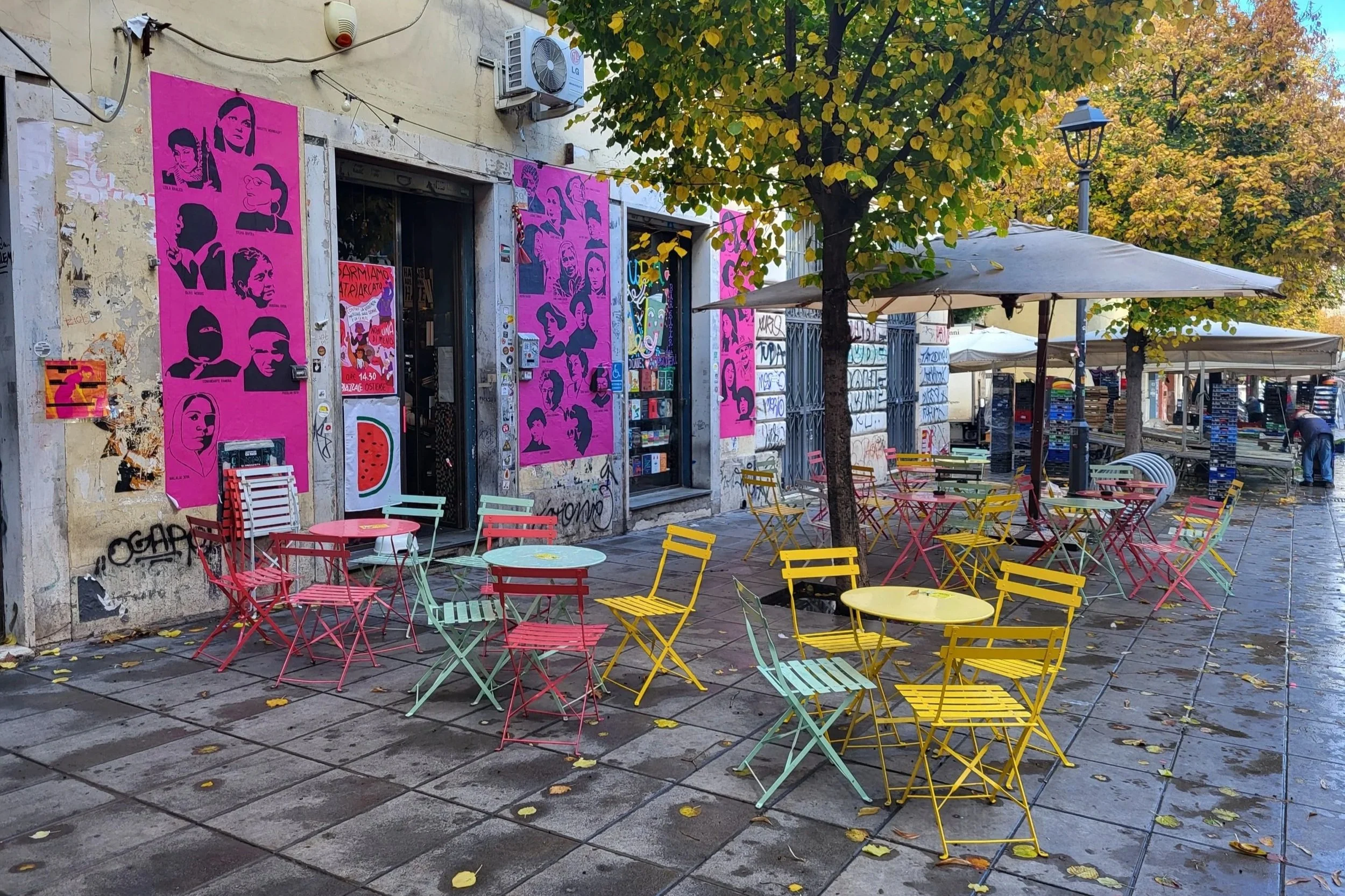 Cafe with colorful chairs in Via del Pigneto