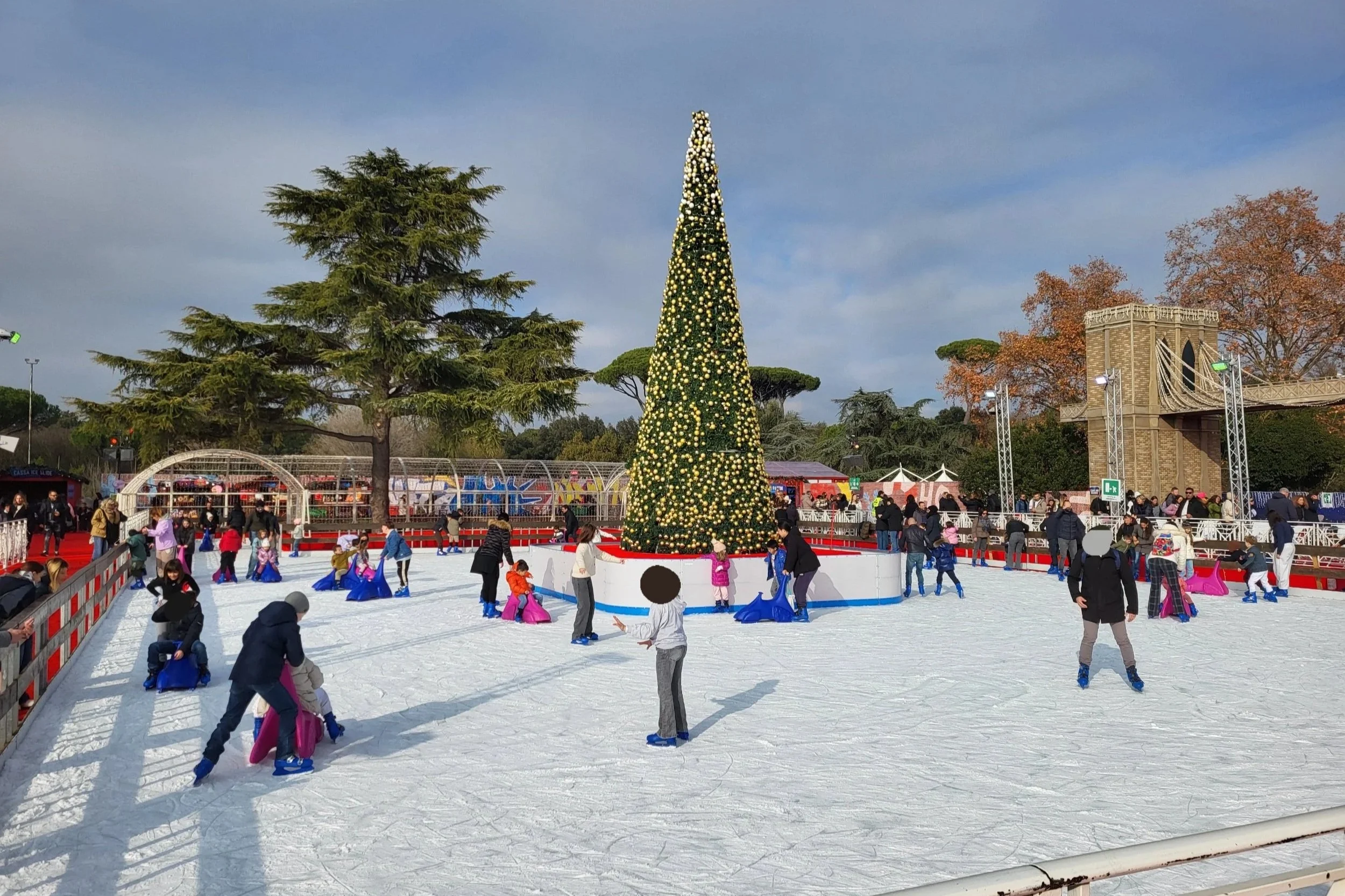 Ice rink at Christmas World Rome with families skating under holiday lights