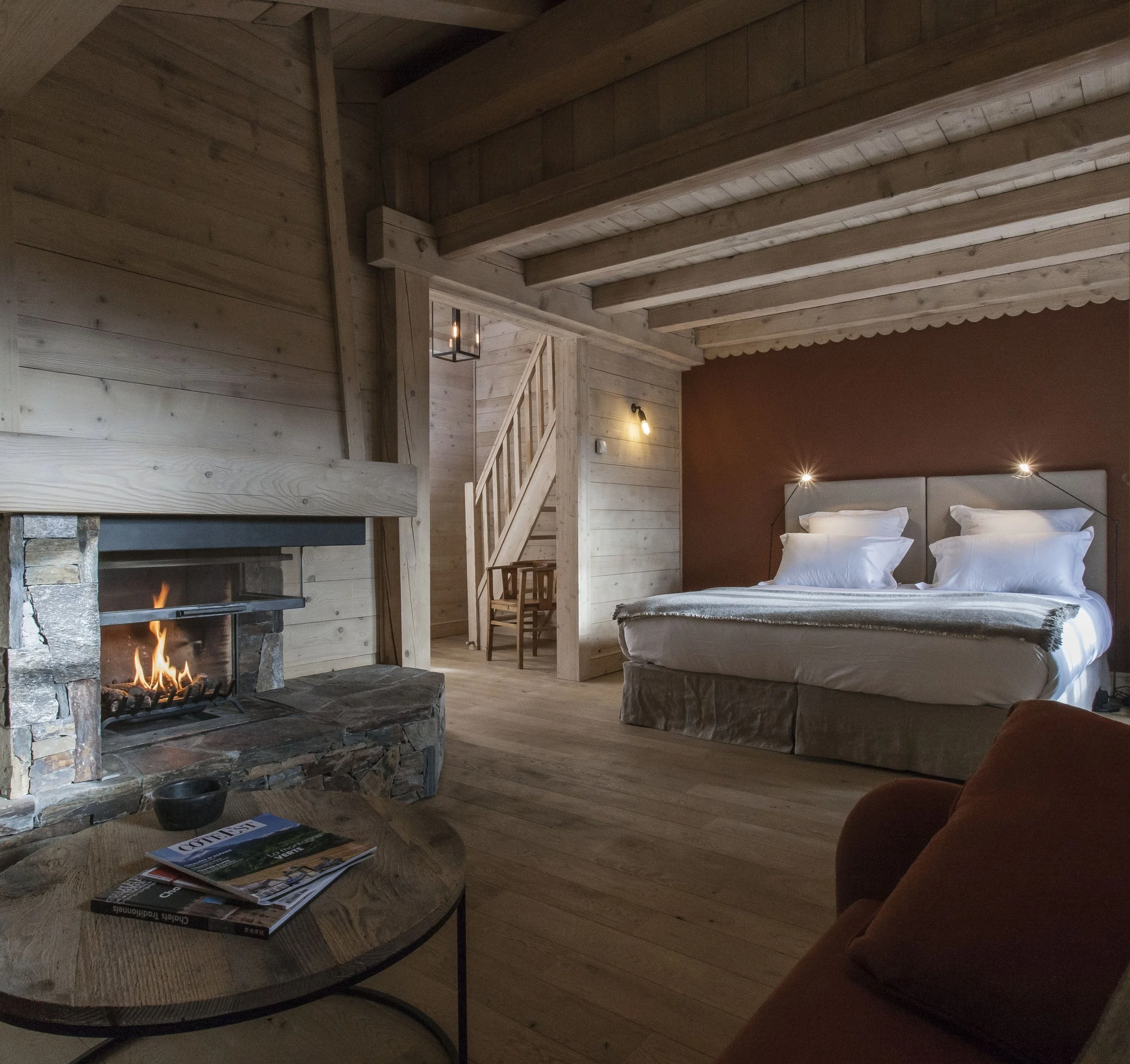 combloux corporate retreat luxury chalet bedroom fireplace