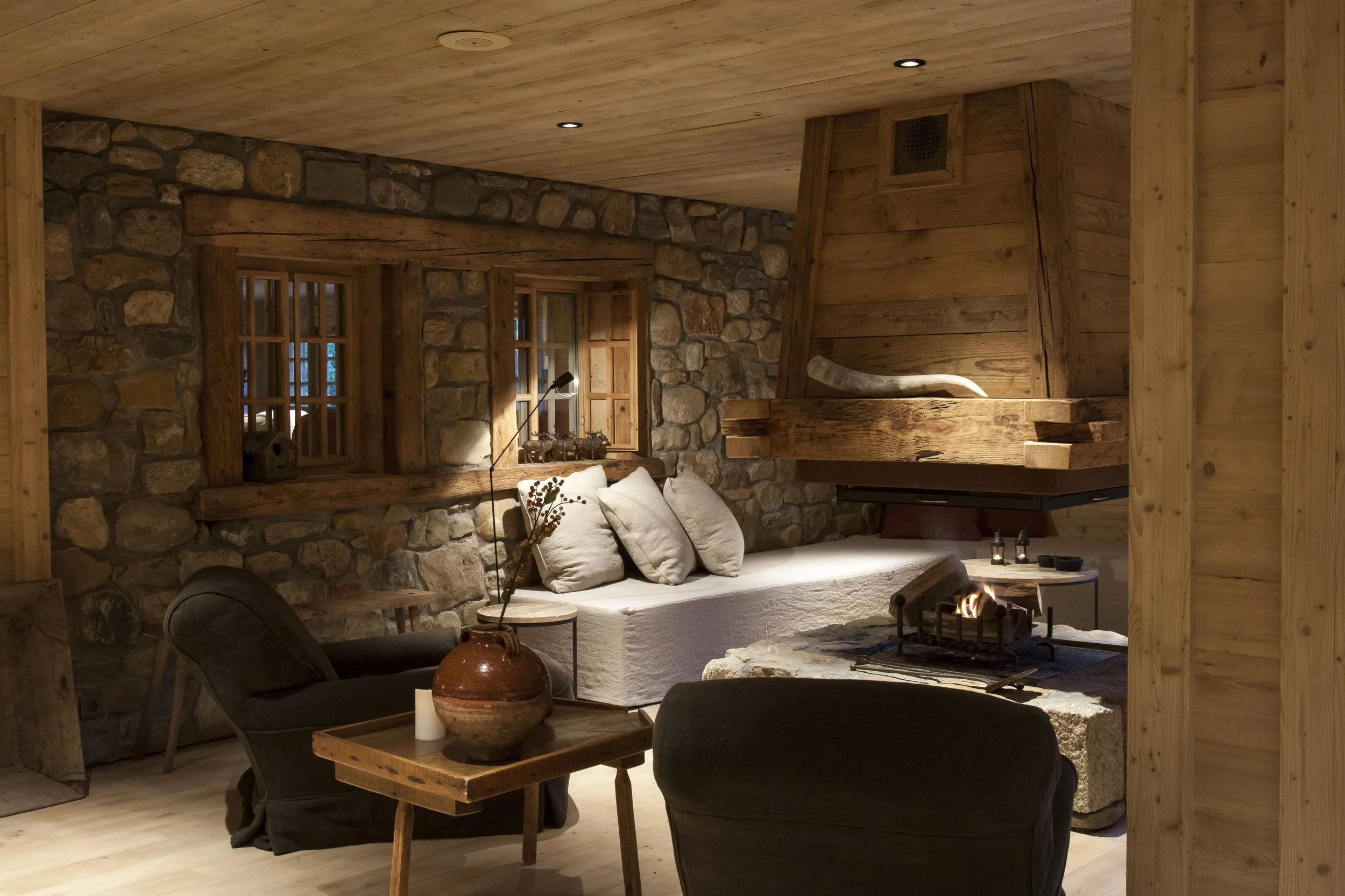combloux corporate retreat luxury chalet sofa fireplace living room