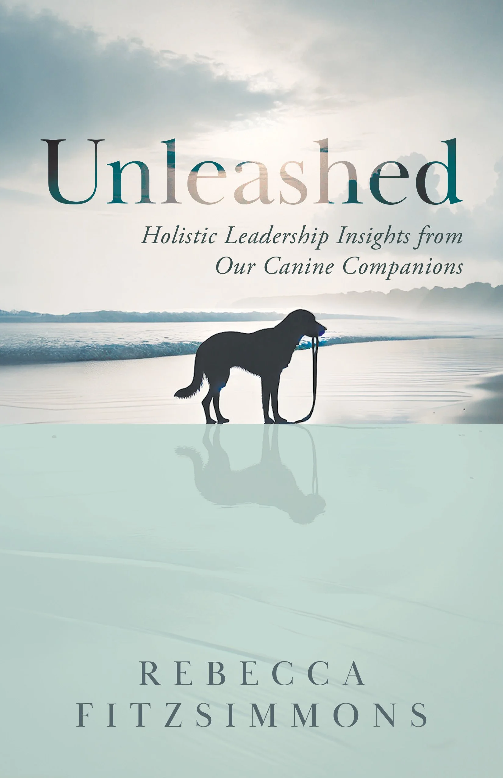Book cover titled "Unleashed" with subtitle "Holistic Leadership Insights from Our Canine Companions" by Rebecca Fitzsimmons, featuring a silhouette of a dog holding a leash in its mouth, standing on a beach near water with a cloudy sky.