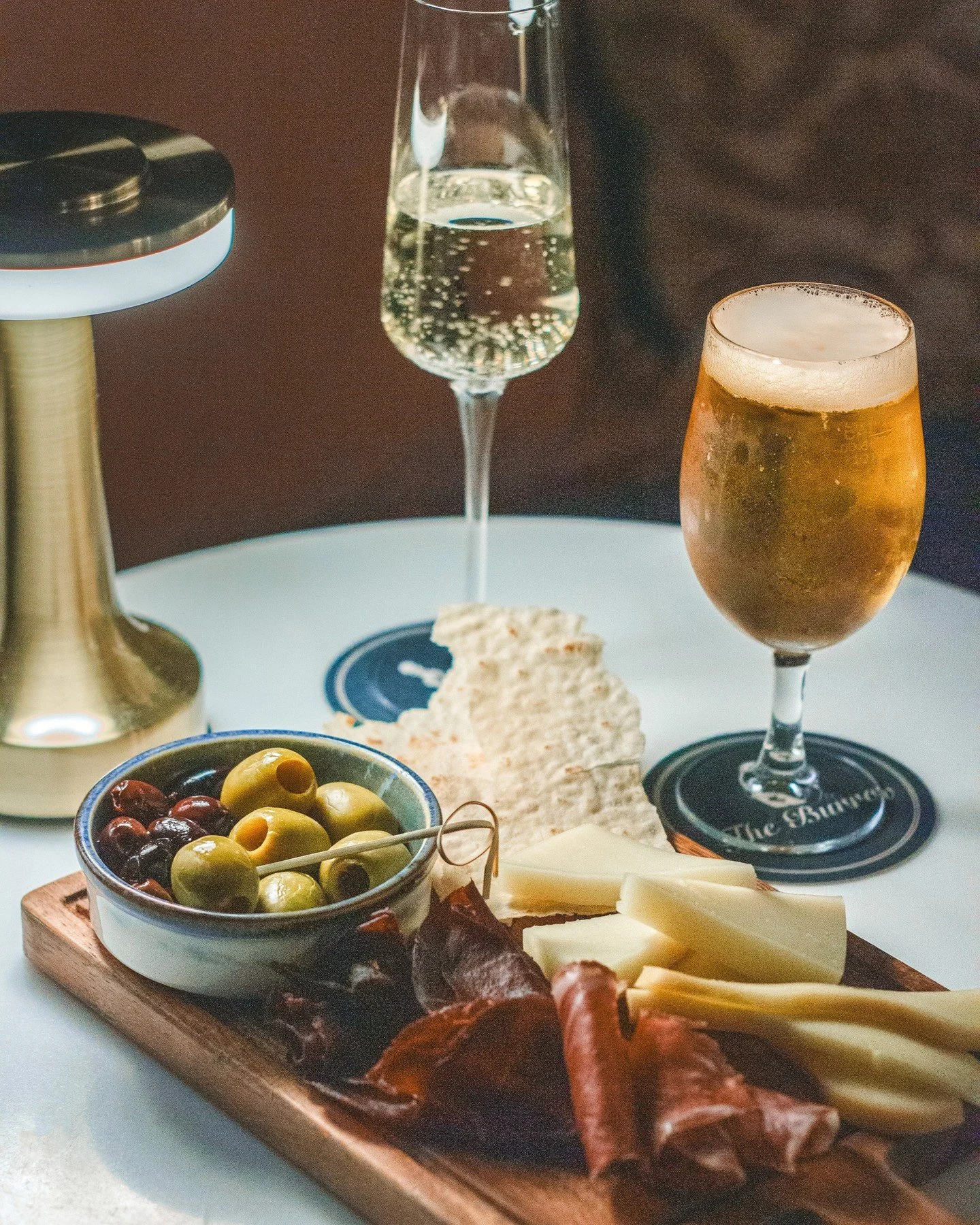 Sip, snack, repeat.!🥂🧀 🫒 The perfect spread for sharing... or not!