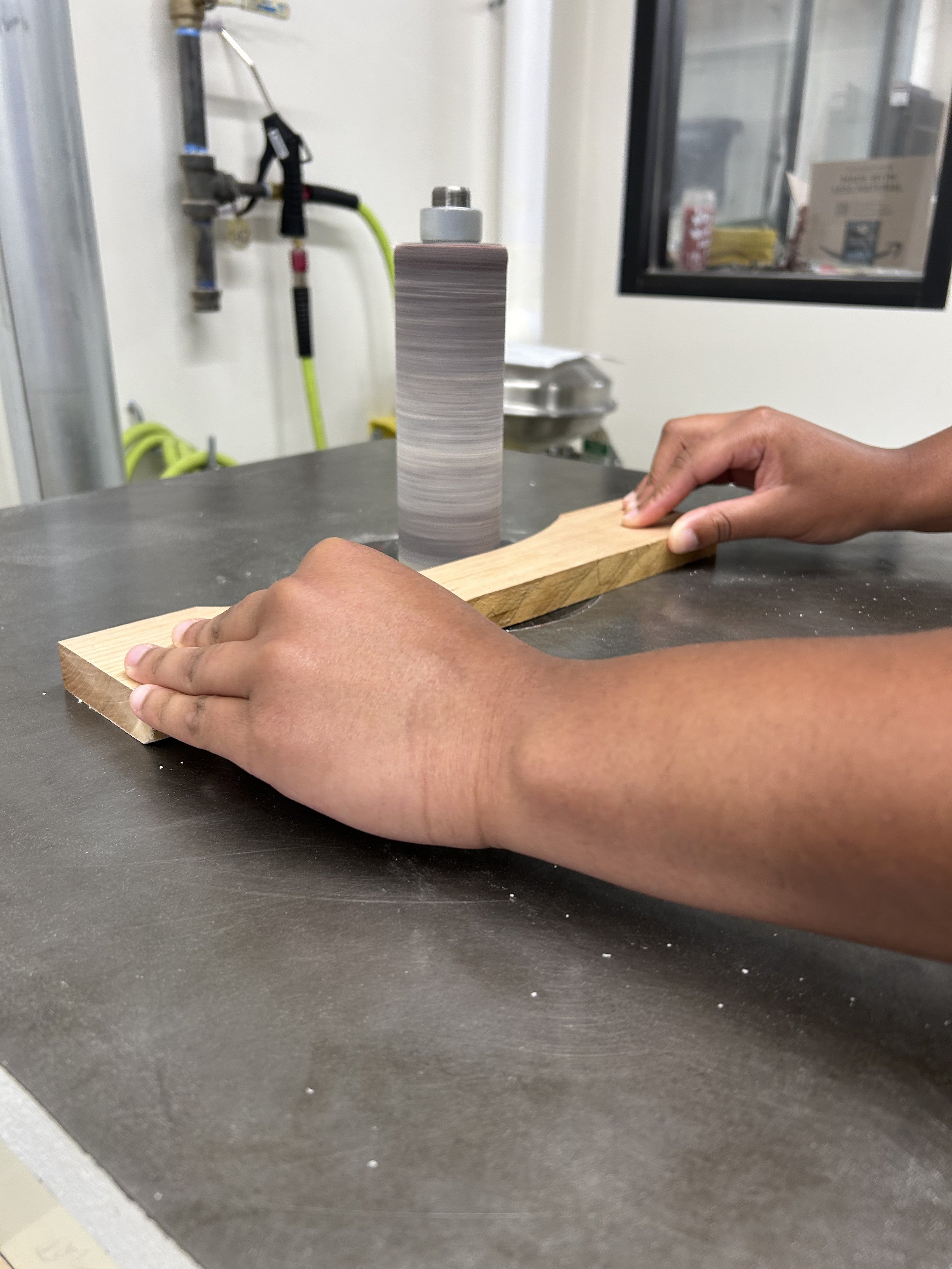 smoothing parts with a spindle sander