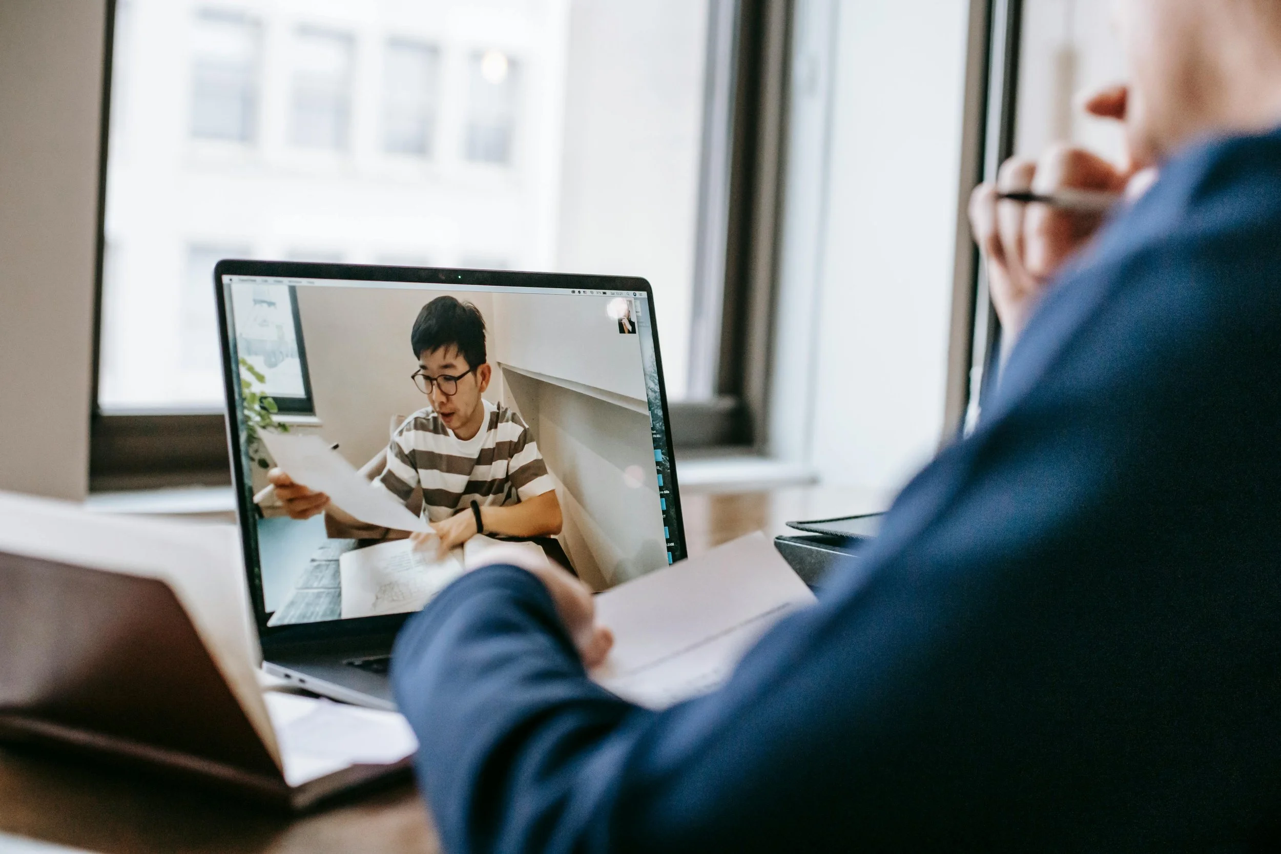 A virtual teacher listens to their student