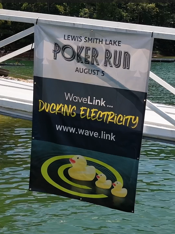 WaveLink Secure took center stage as the lead sponsor of the Poor Man Poker Run at Lewis Smith Lake, where each sponsored dock brought a unique theme to life. Our dock embraced the playful theme "WaveLink...Ducking Electricity," adding a splash of cr