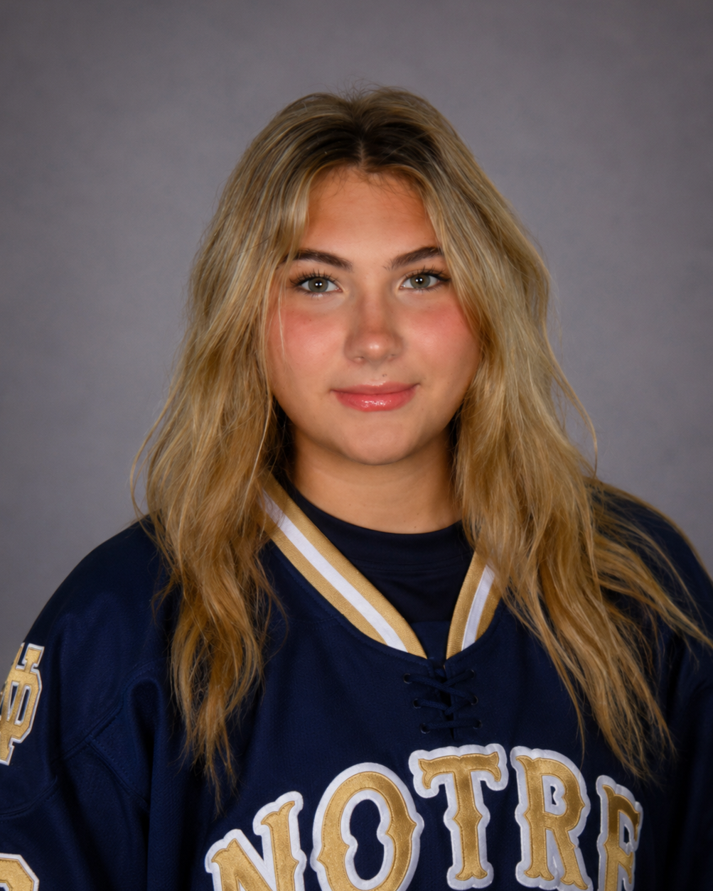 Notre Dame women's hockey logo with large white letter N and D on dark blue background, with white text below.