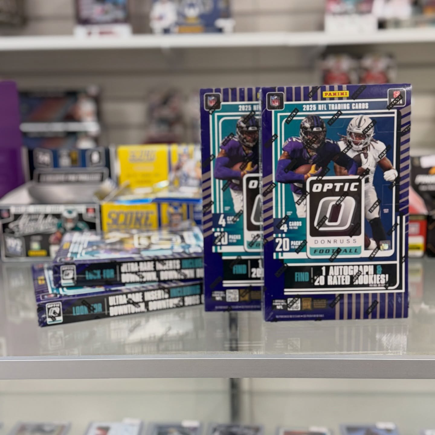 2025 @paniniamerica Donruss Optic Football is officially in the shop! 🏈🔥
Chase one autograph per box, plus hunt for exclusive gold Downtowns and Dual Downtowns, and more.

Supplies are limited, so don&rsquo;t wait &mdash; stop in and secure yours b
