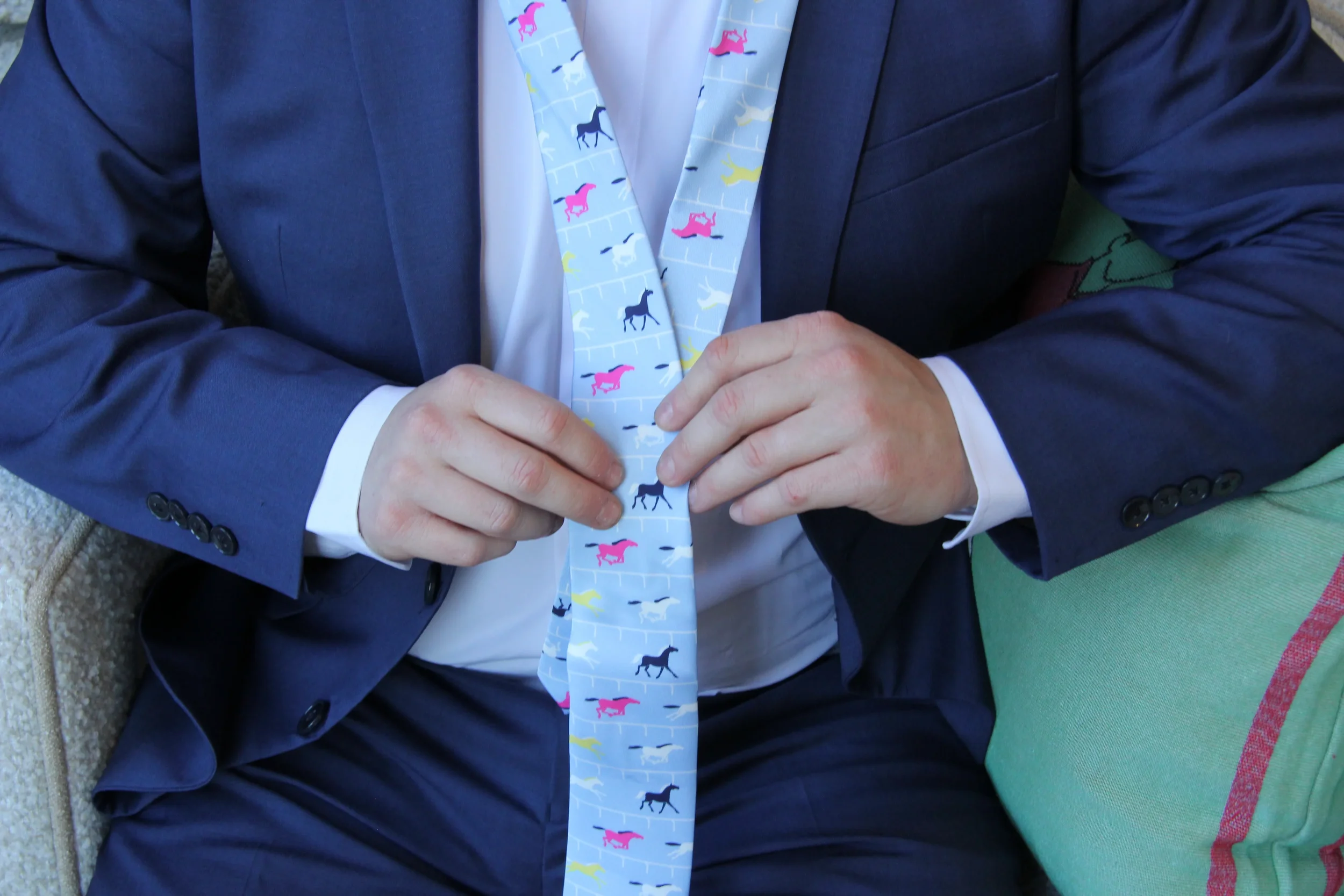 light-blue-multi-color-horse-racing-necktie-worn.webp