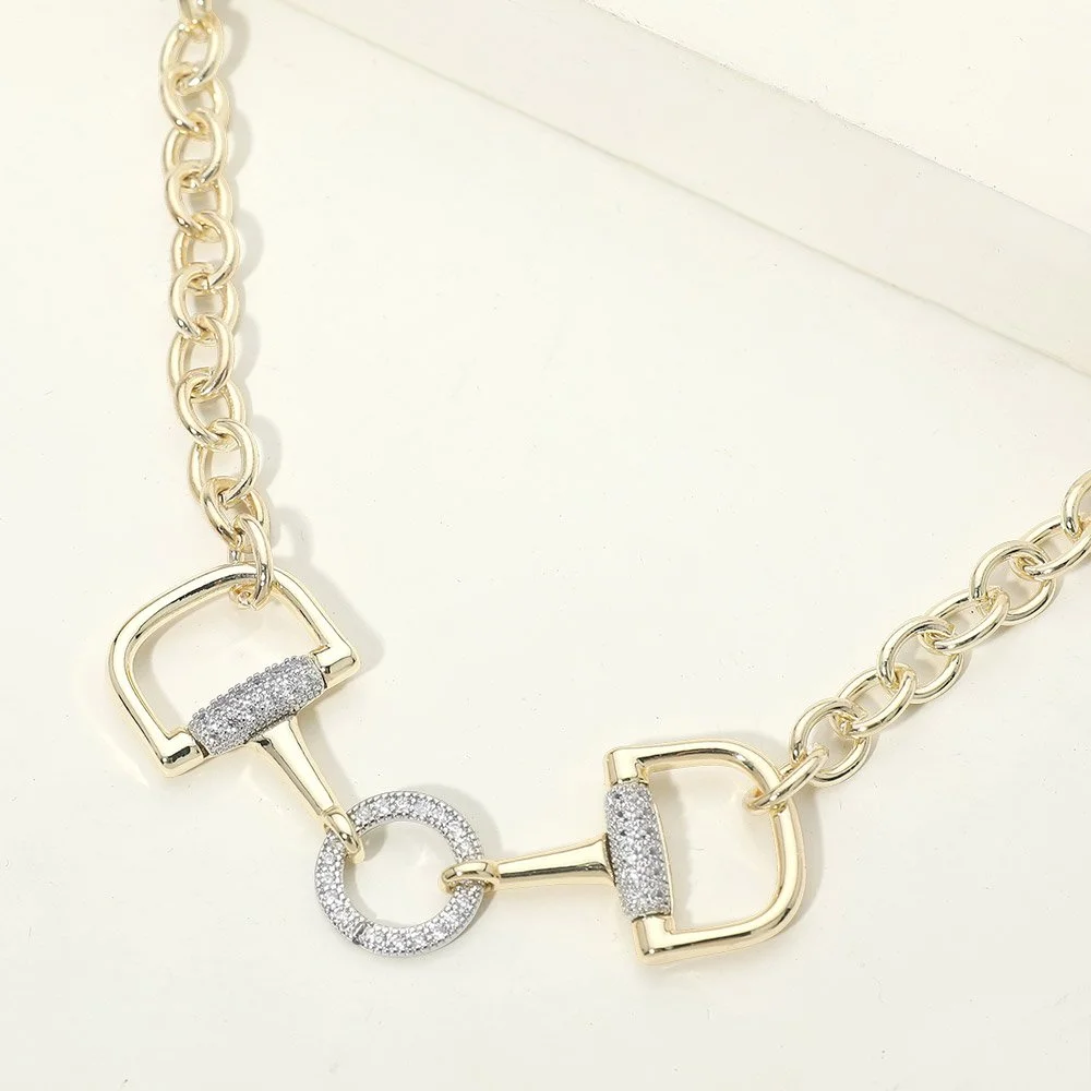Close-up of gold pavé horsebit link necklace with sparkling CZ accents