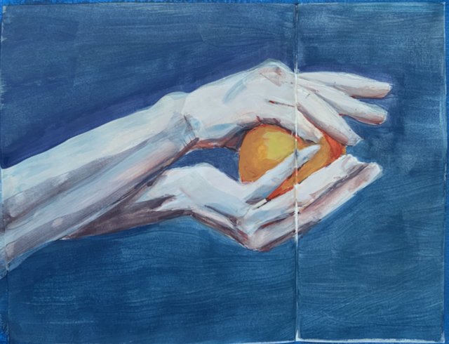 holding an orange