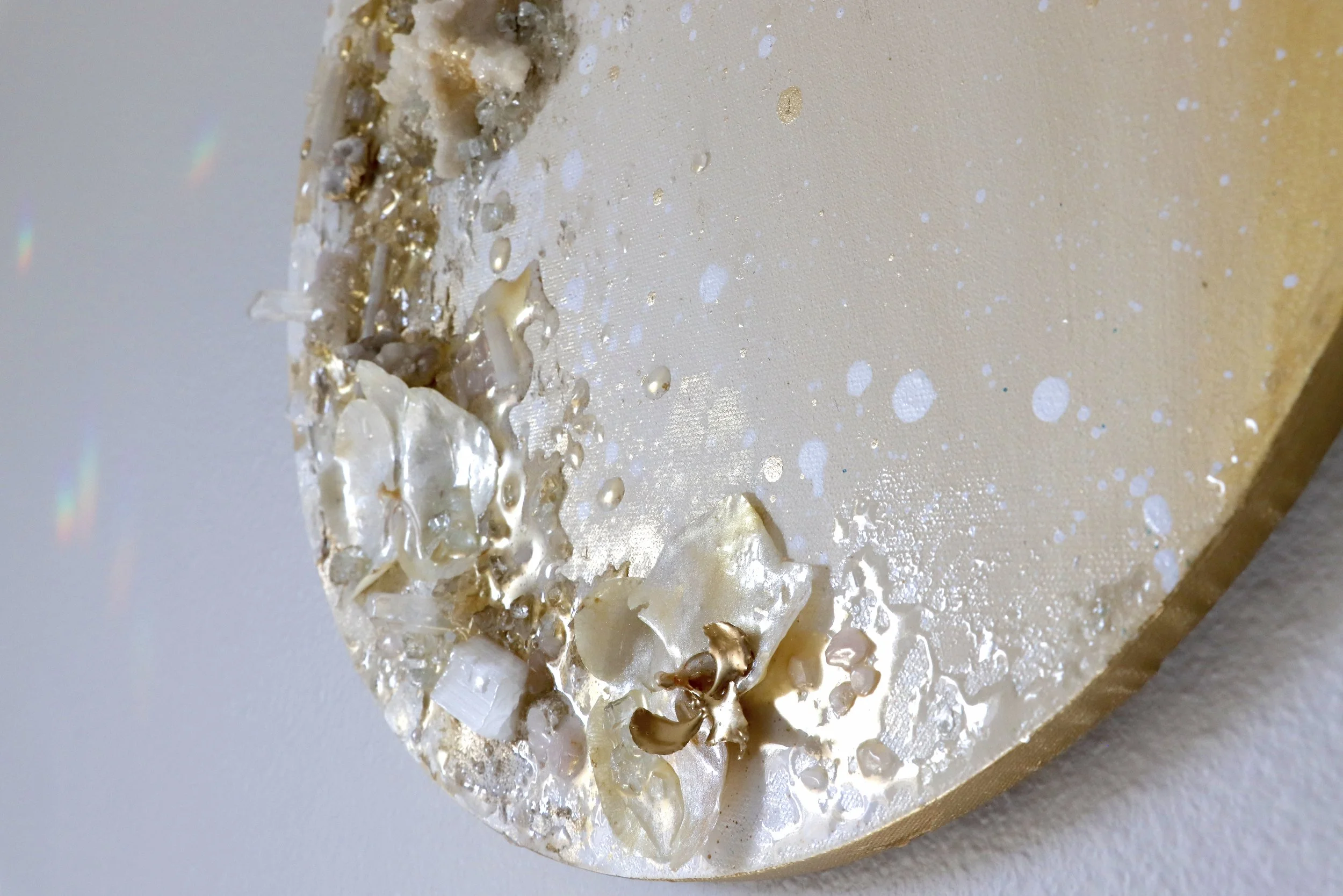 detail photo of gold wall art close up of orchids and selenite crystals