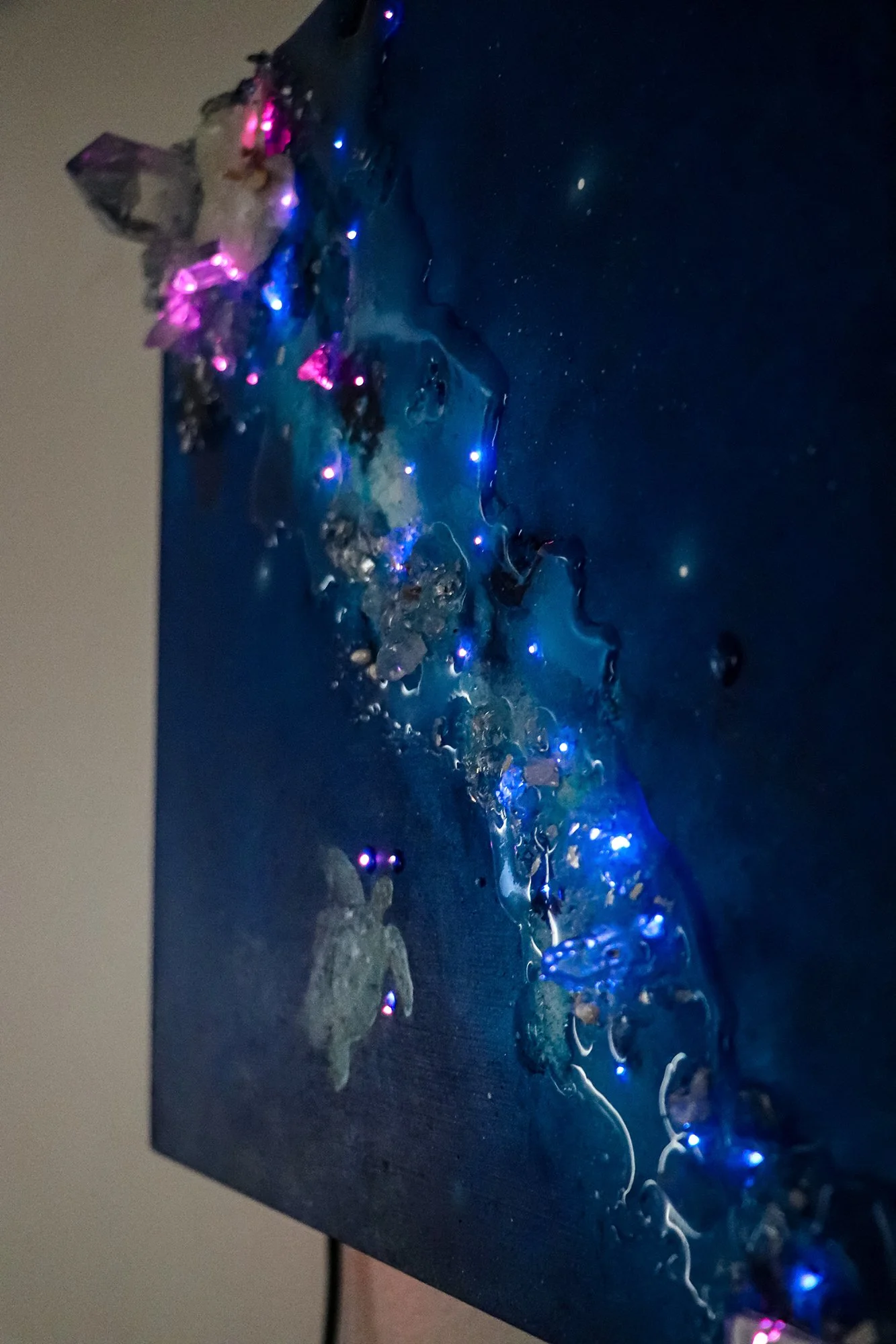 close up detail photo of fiber optic lighting on blue luxury wall art
