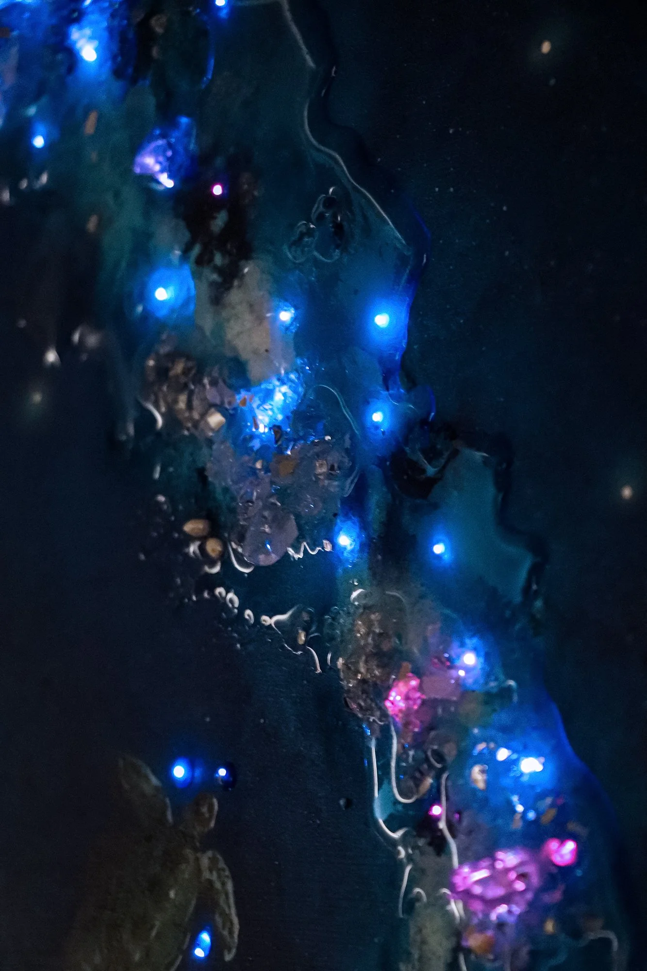 close up detail photo of blue textured wall art with fiber optic LED lighting