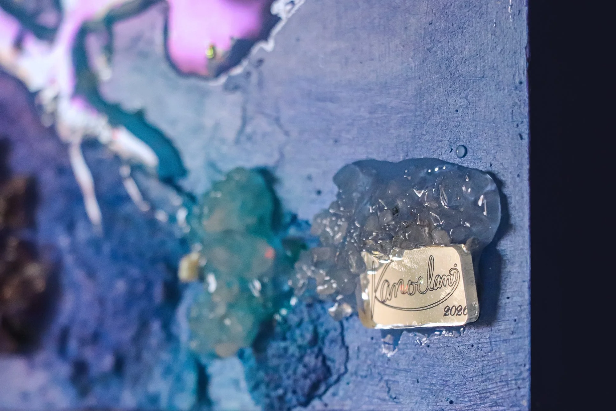 name plate on painting with artists signature