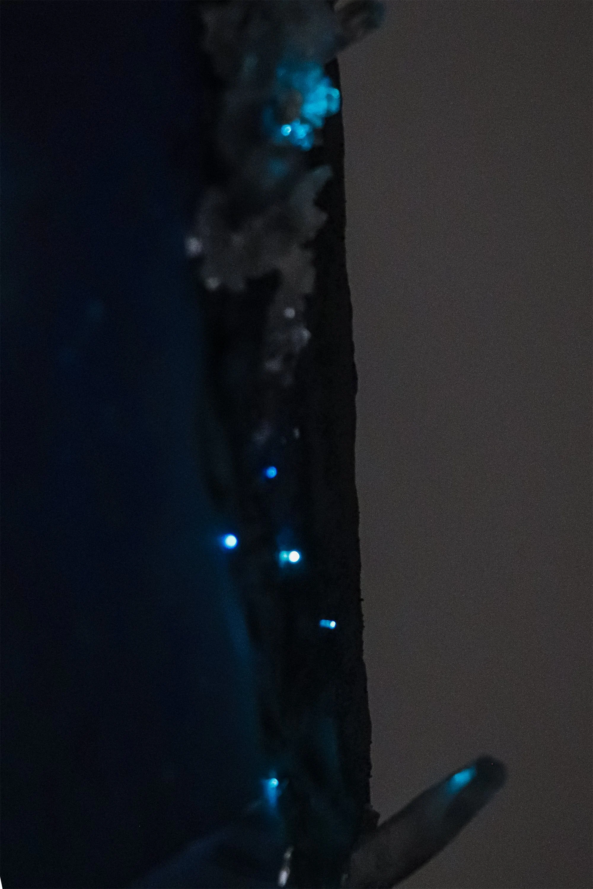 close up of crystals with glowing blue fiber optic LED light