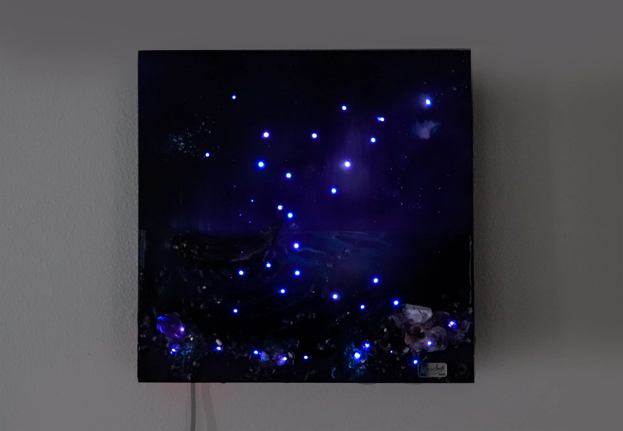 purple abstract wall art hanging, with glowing fiber optic light, orchid botanicals and amethyst crystals, textured resin art