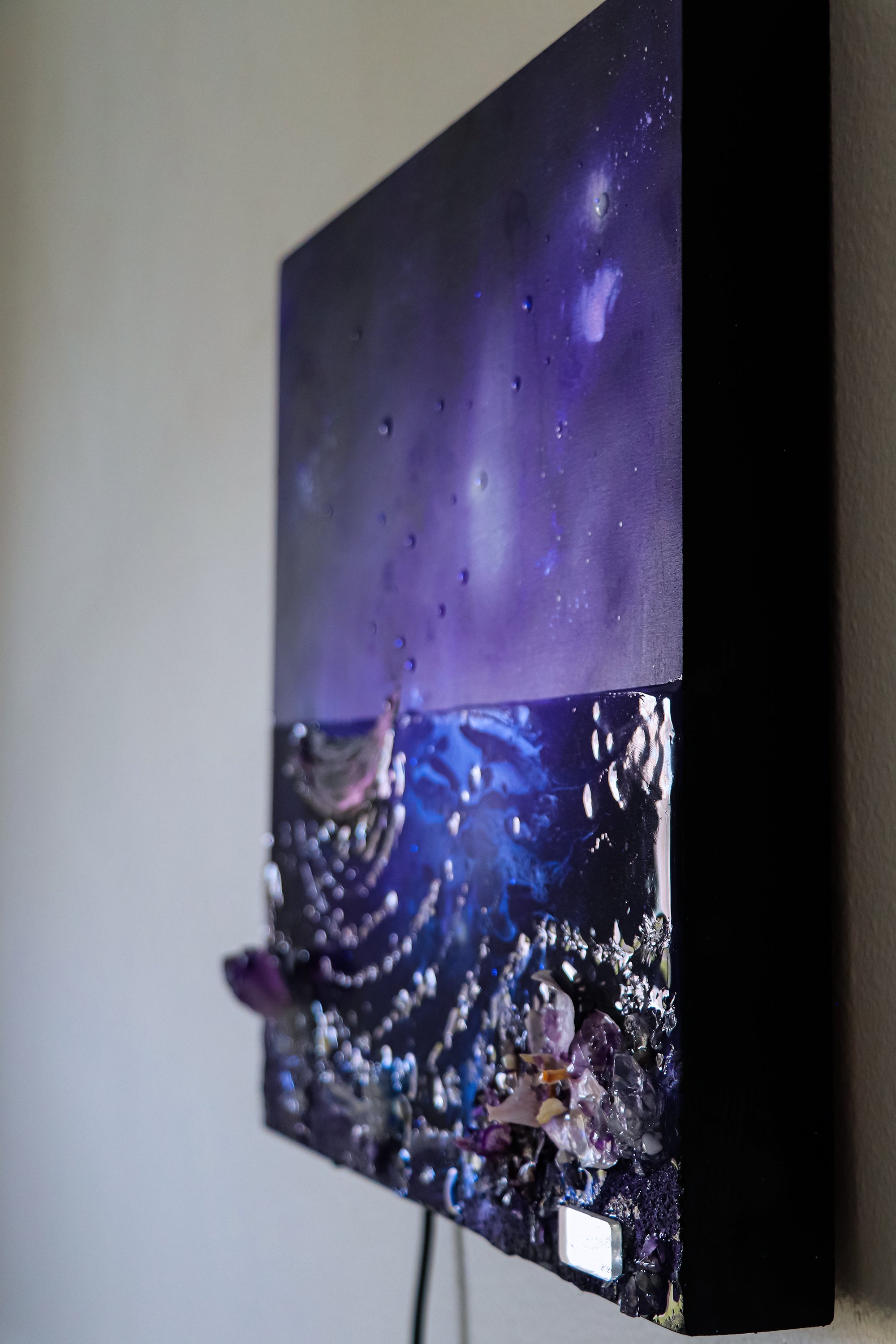 side view of purple wall art painting hanging