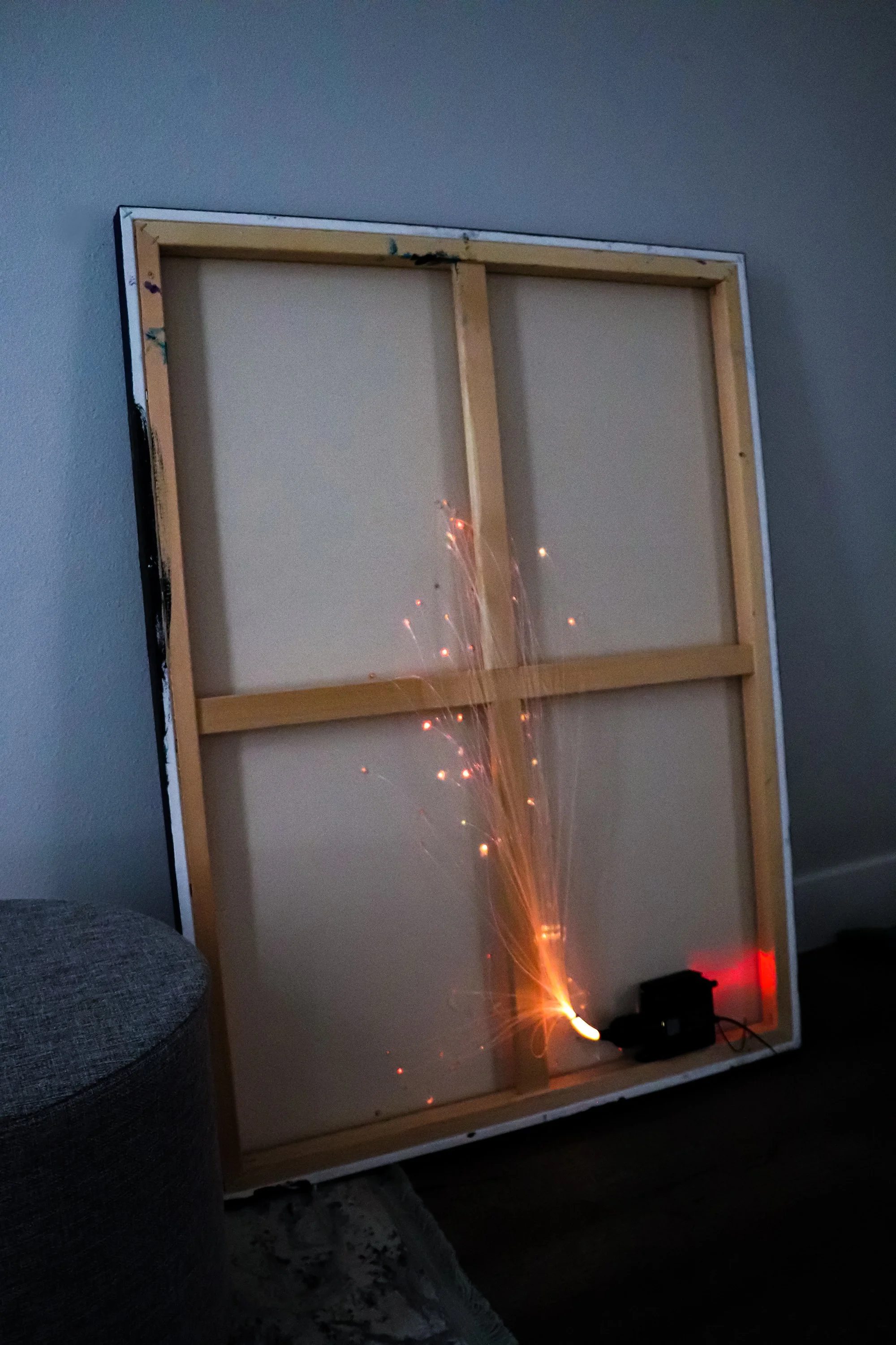 back of painting with fiber optic light display
