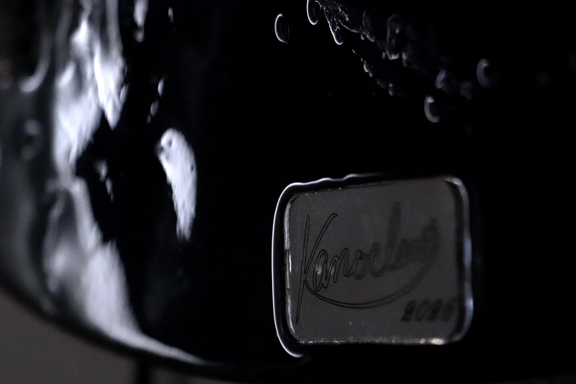 close up detail photo of artist signature name plate Kanoelani 2026