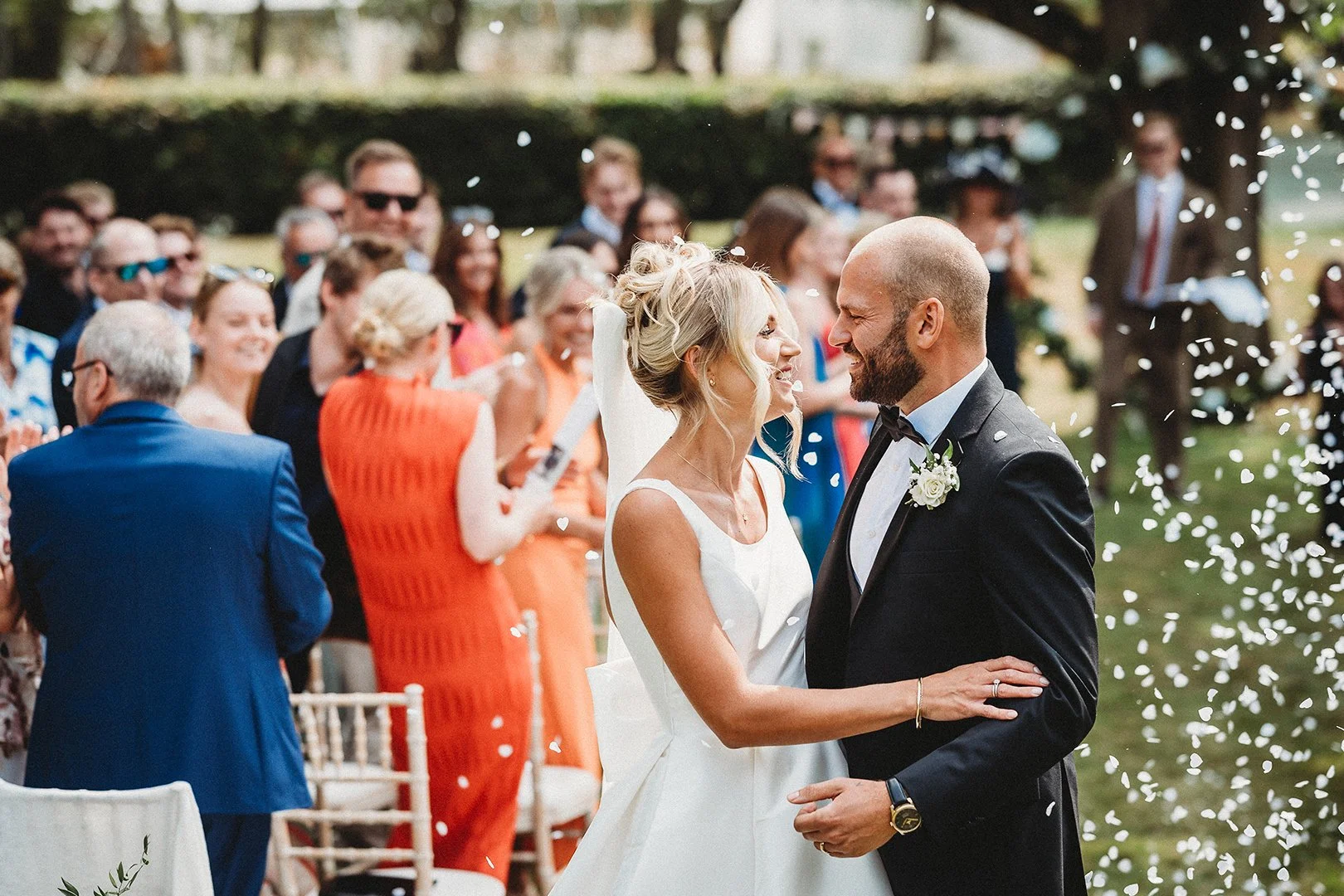 Bride and groom celebrating during golden hour wedding photography in Norwich Norfolk