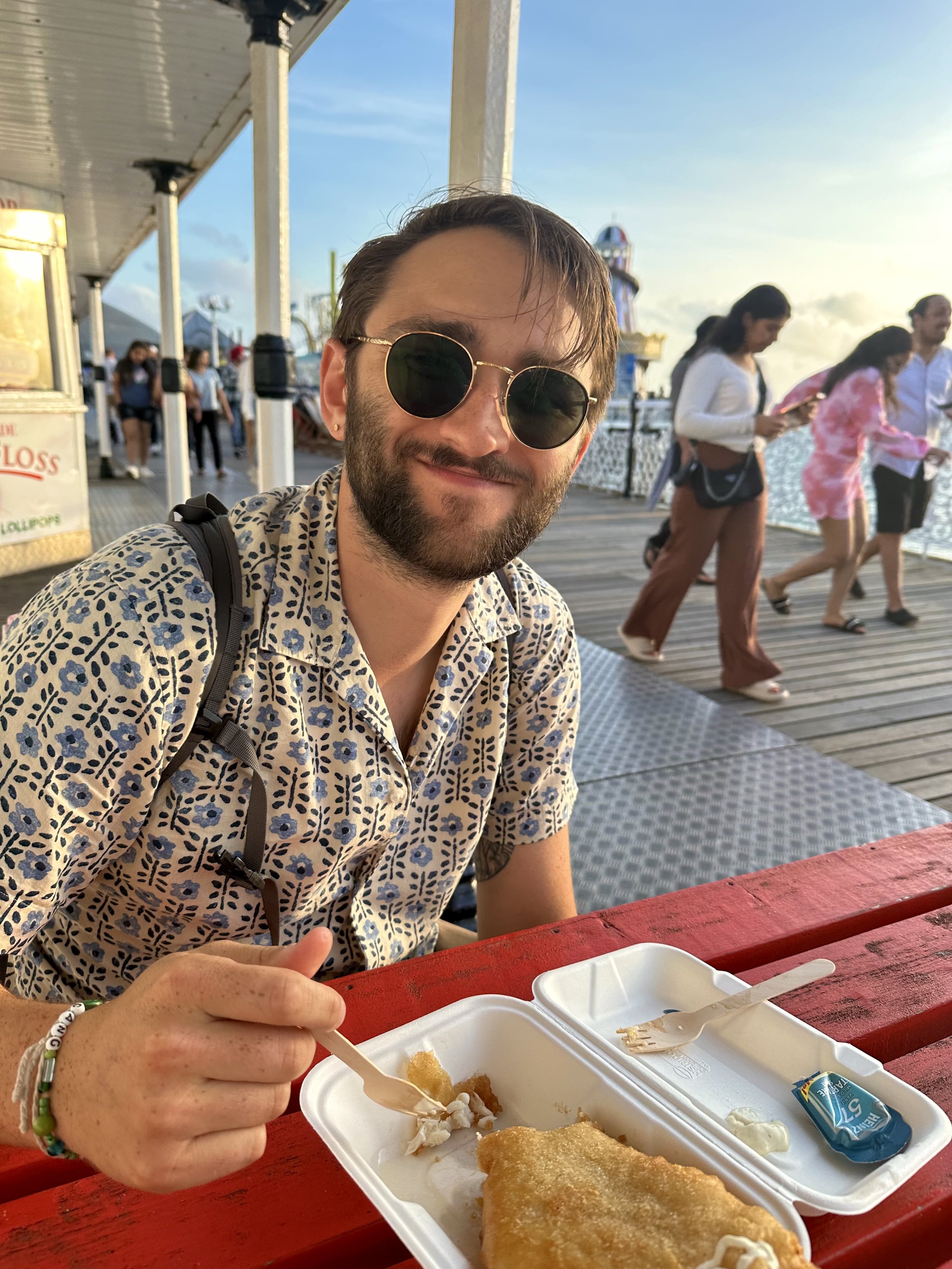 Grant eating fish and chips in Brighton