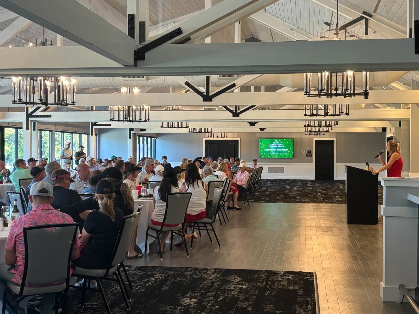 Golfers seated for the lunch program at Mission on the Green, the Christmas Commandos charity golf tournament at Morris Park Country Club in South Bend