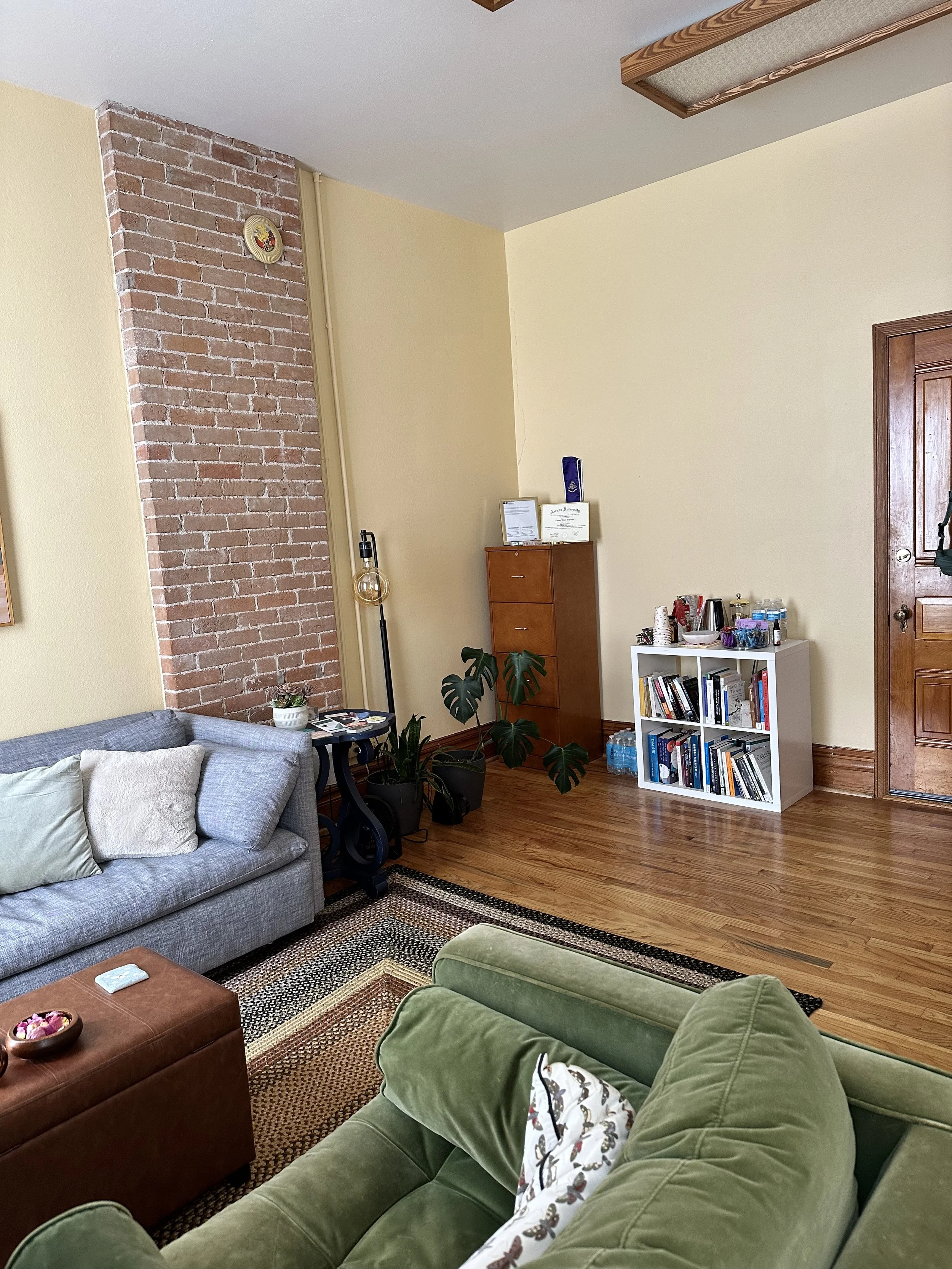 other side of office featuring a bookshelf and filing cabinet