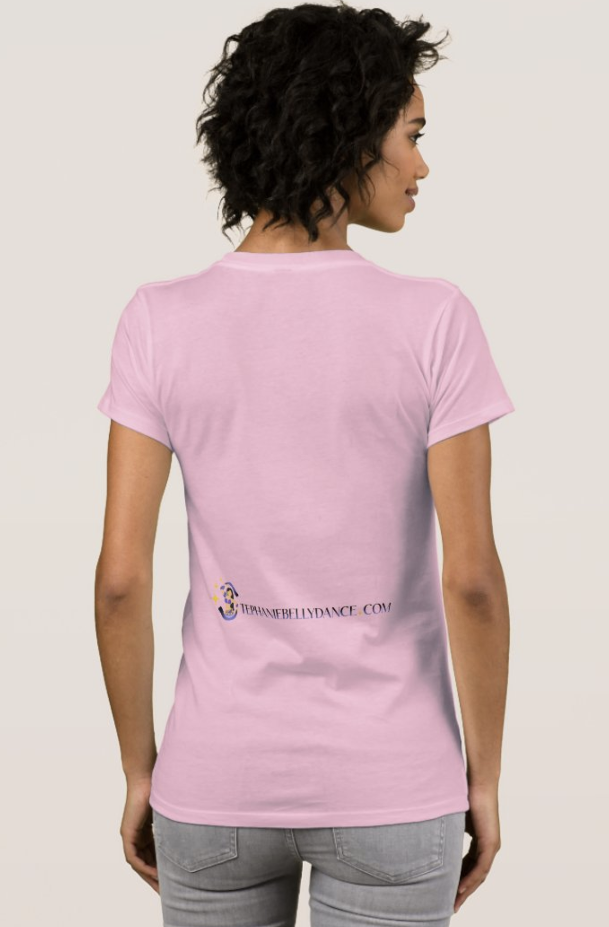 The "High and Low" T-Shirt showcases the banner logo that opens up Stephanie's videos. The back features an unexpected twist in the placement of the linear website logo, near the waistline.