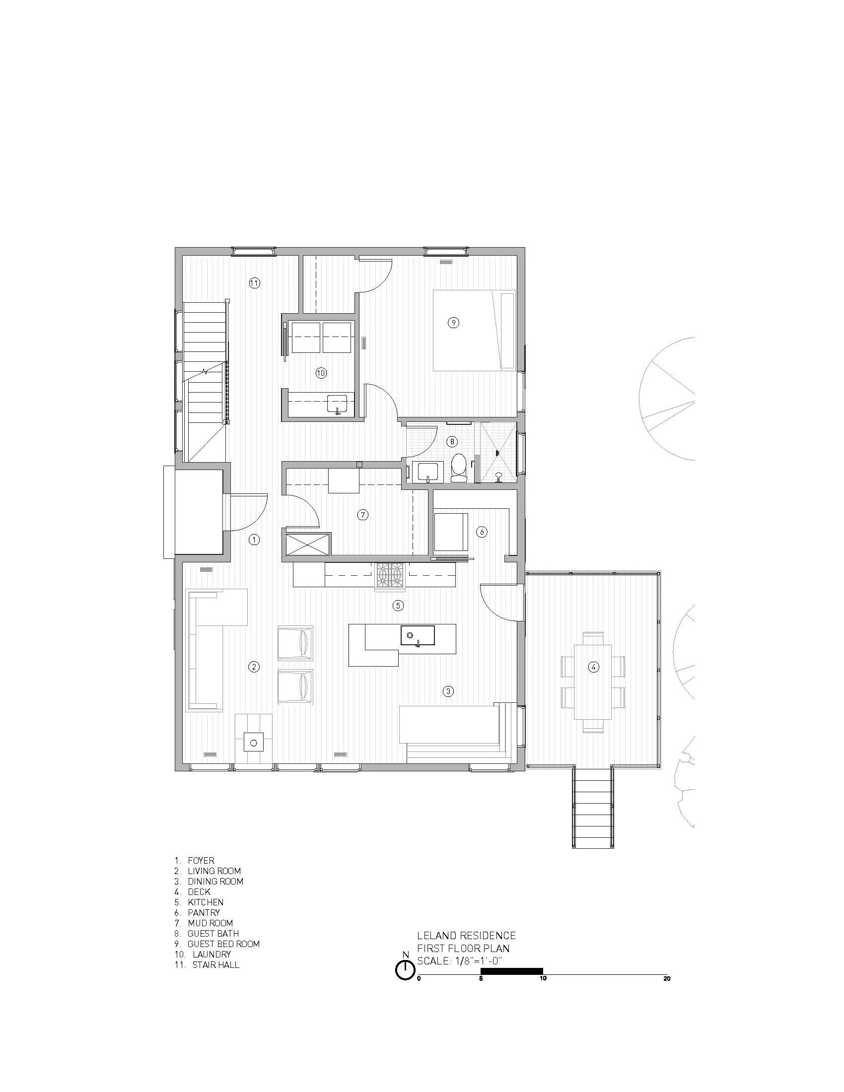 Floor plan layout of a residence, including rooms like foyer, living room, dining room, kitchen, pantry, guest bedroom, guest bath, laundry, stair hall, and deck, with labeled areas and a north directional arrow.