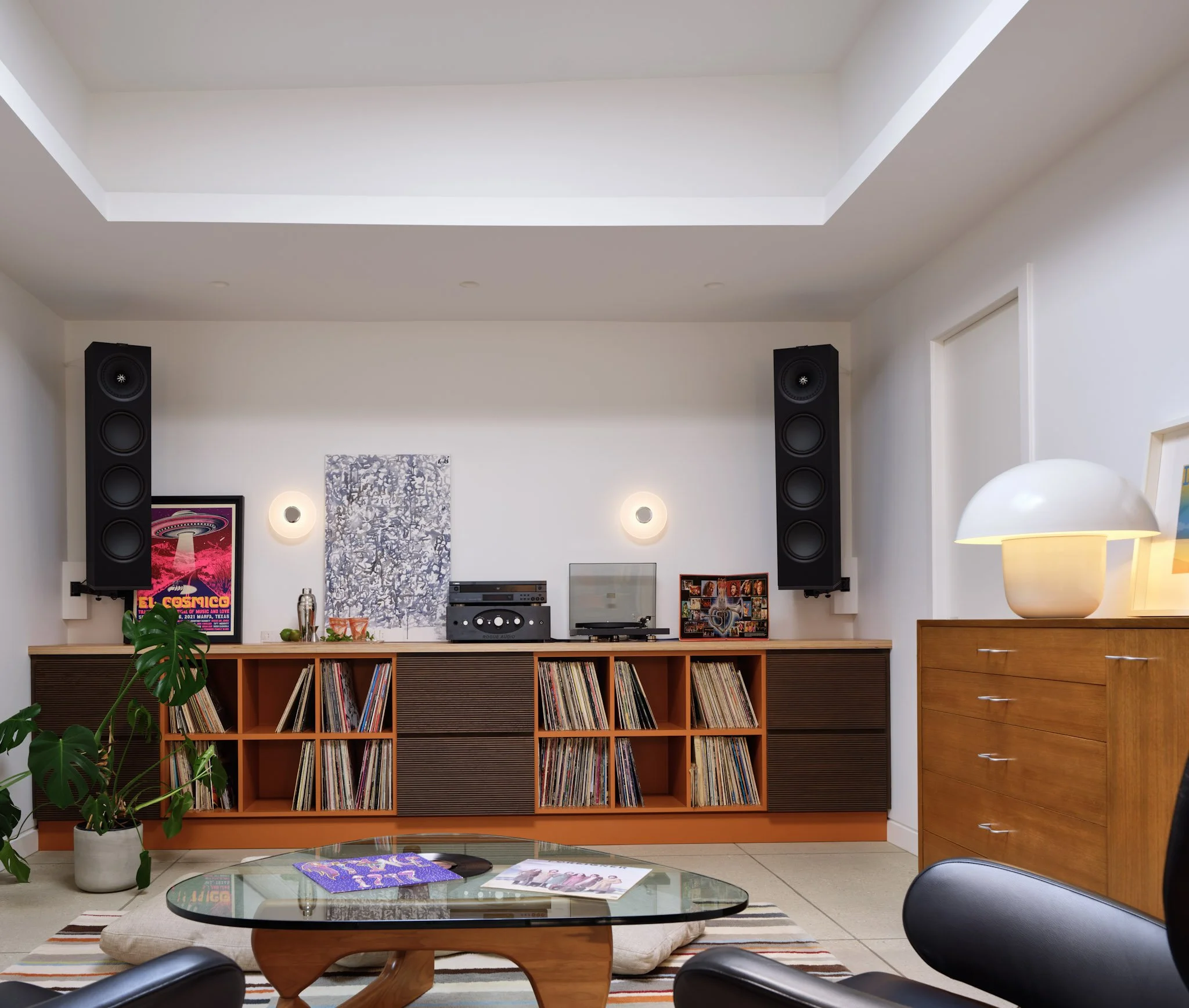Music room with detailed millwork record shelving and premium sound system