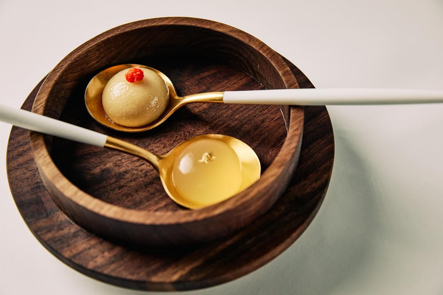 A modern take on xiao long bao. Spherified pork broth paired with Iberico pork and a touch of pickled ginger. Served alongside a cocktail sphere inspired by the classic Singapore Sling. Two perfect bites, savoury and spirited.

📸: @jonolawley