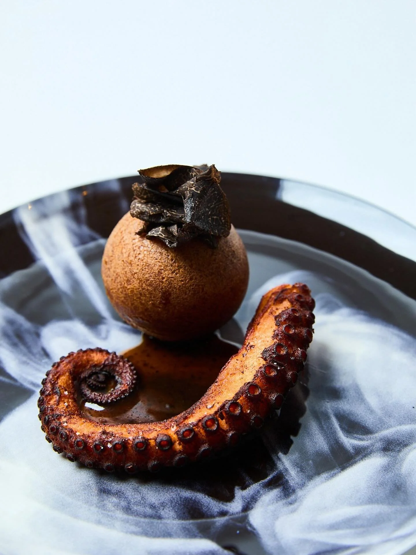 In honour of World Octopus Day, we celebrate the spirit of takoyaki &mdash; transformed with black truffles, refined textures, and layered flavours. A tribute to Asian street food culture elevated through the artistry of fine dining.

The Asian Stree