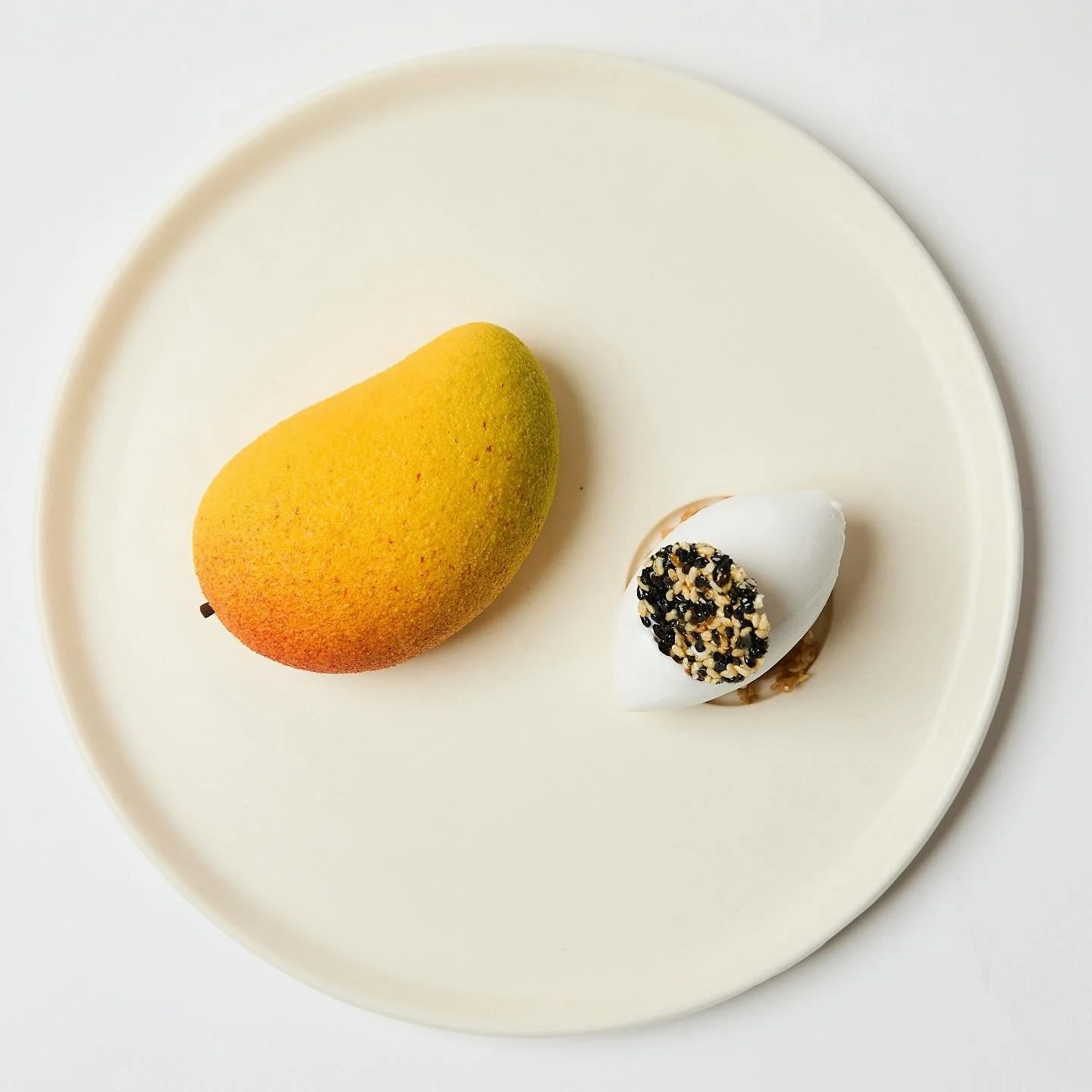 A celebration of sweetness and craft.
Our mango dessert, inspired by Thailand’s beloved mango sticky rice, transforms a timeless favourite into something elegant and new. Each element highlights the natural richness of mango, vibrant, fragrant