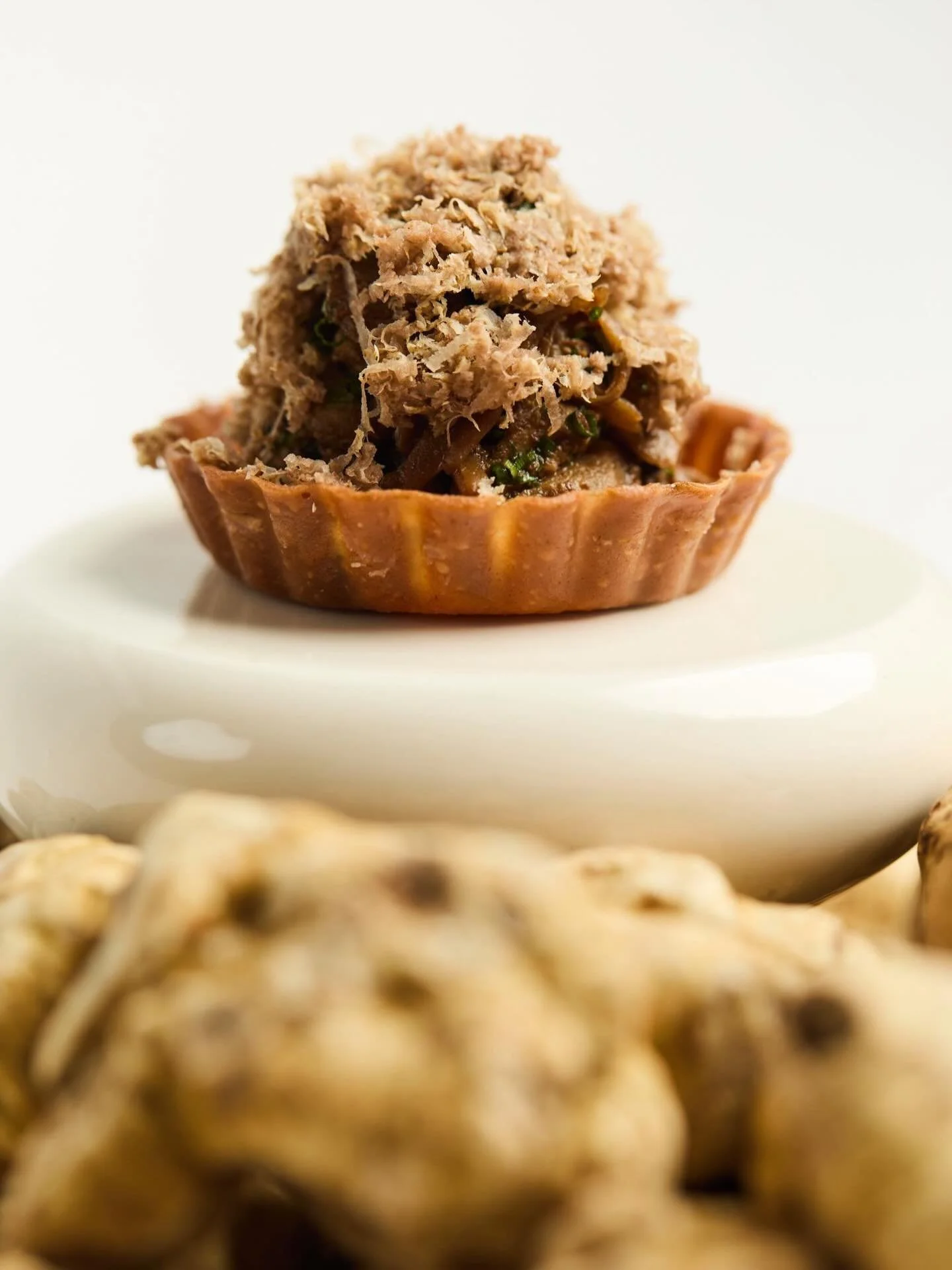 The Yunnan Tart.

The 11th course and current supplement, inspired by Yunnan, China, a province celebrated for its wild mushrooms. This option highlights some of Canada&rsquo;s finest mushrooms. BC chanterelles and Ontario shogun maitake, slowly cook